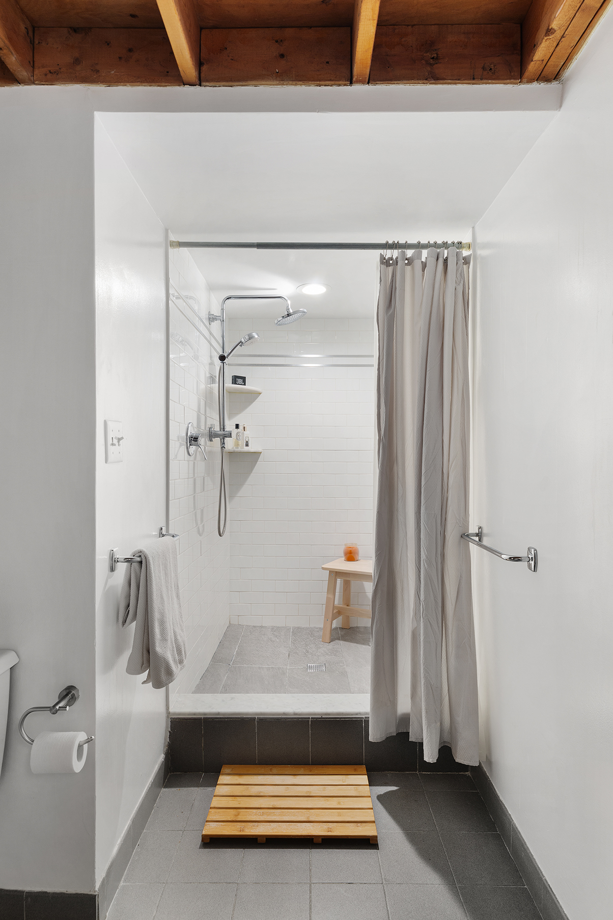135 Greene Street, Unit 2N Manhattan, NY 10012 - Photo 11 of 13 a bathroom with a tub and shower