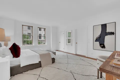 a bedroom with a bed and a couch