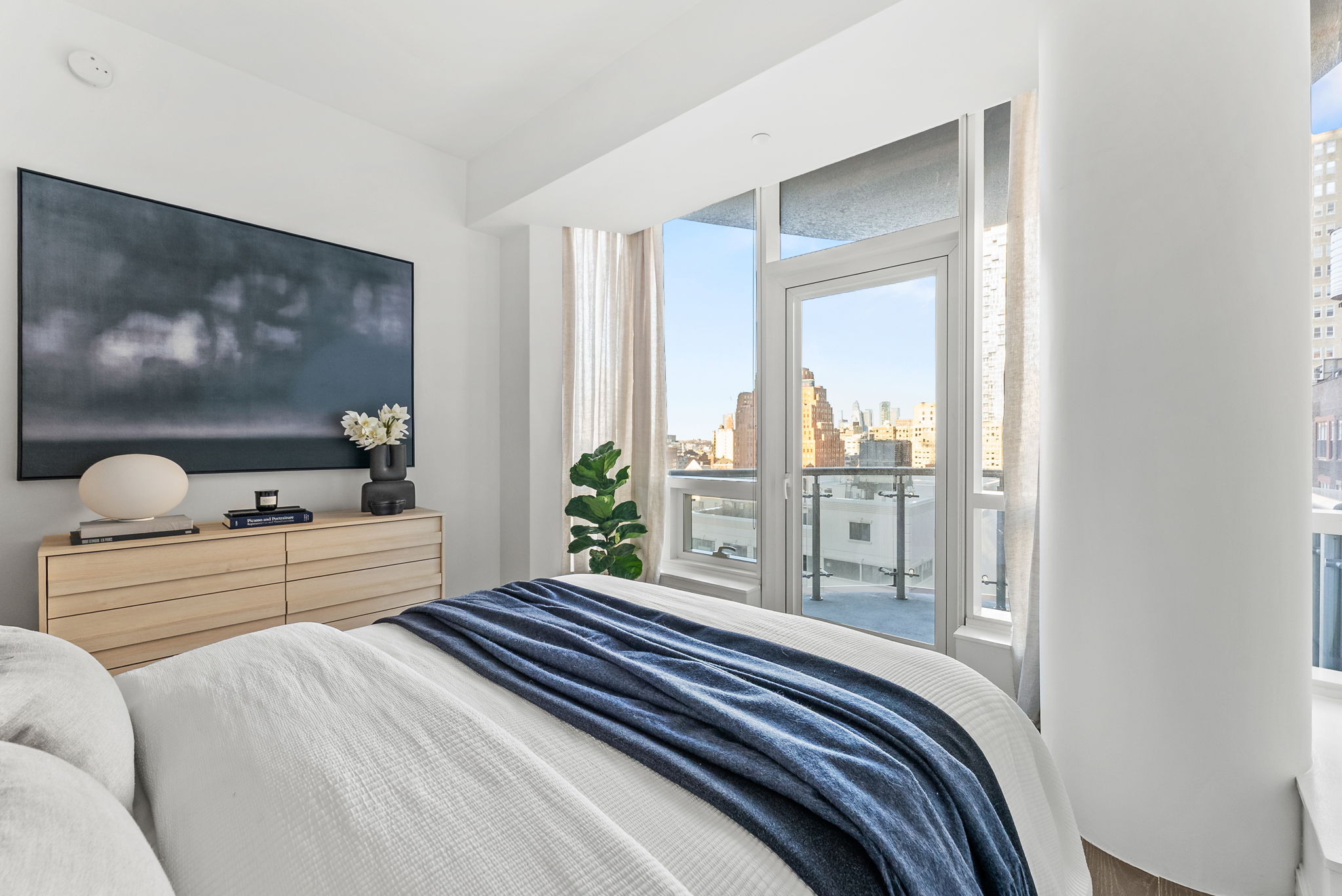 19 Park Place, Unit 14A Manhattan, NY 10007 - Photo 9 of 19 a bedroom with a large bed and a large window