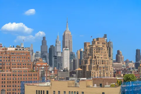 a view of city with tall buildings