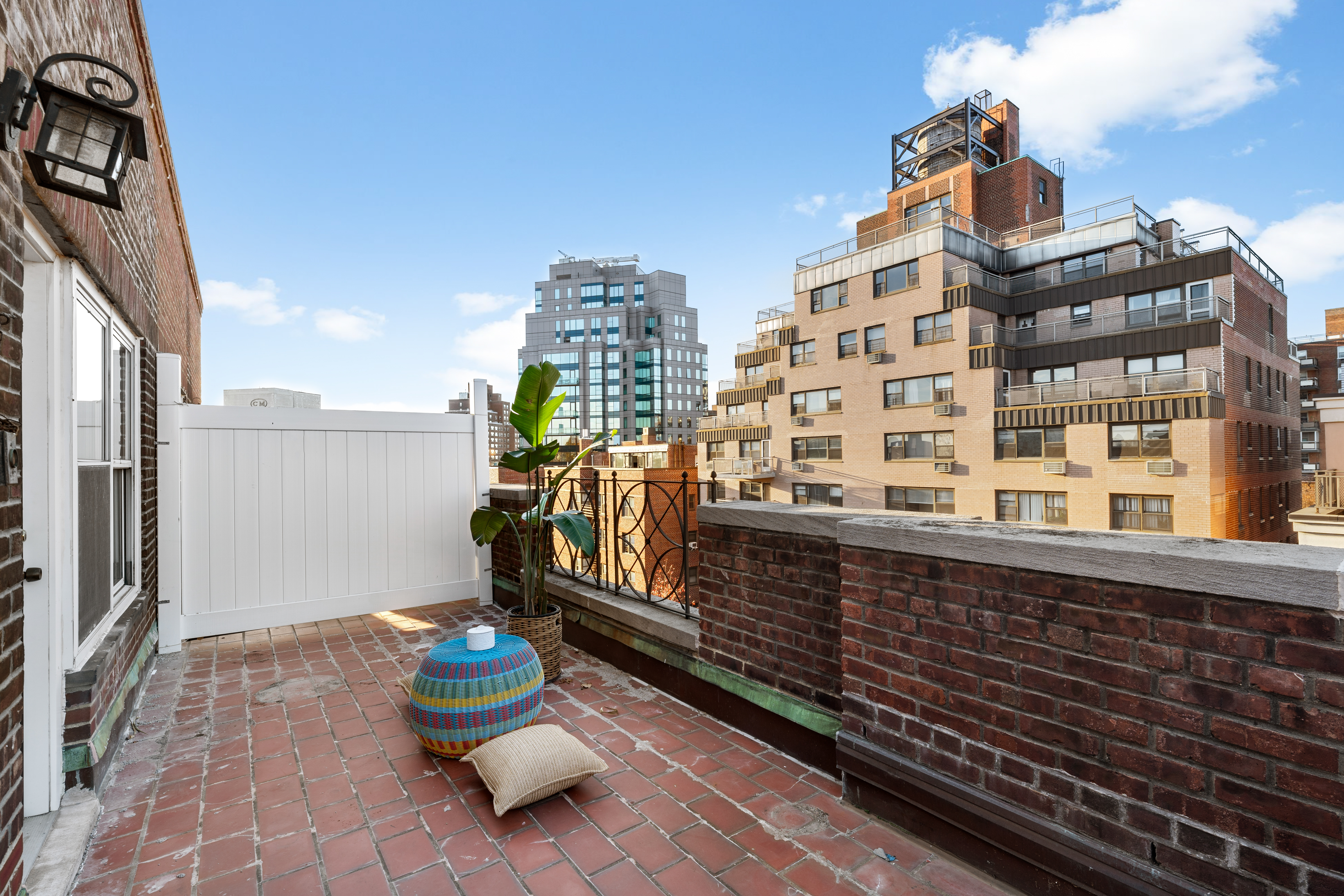 71-36 110th Street, Unit PH7E Queens, NY 11375 - Photo 7 of 16 a view of a balcony with chair and potted plants