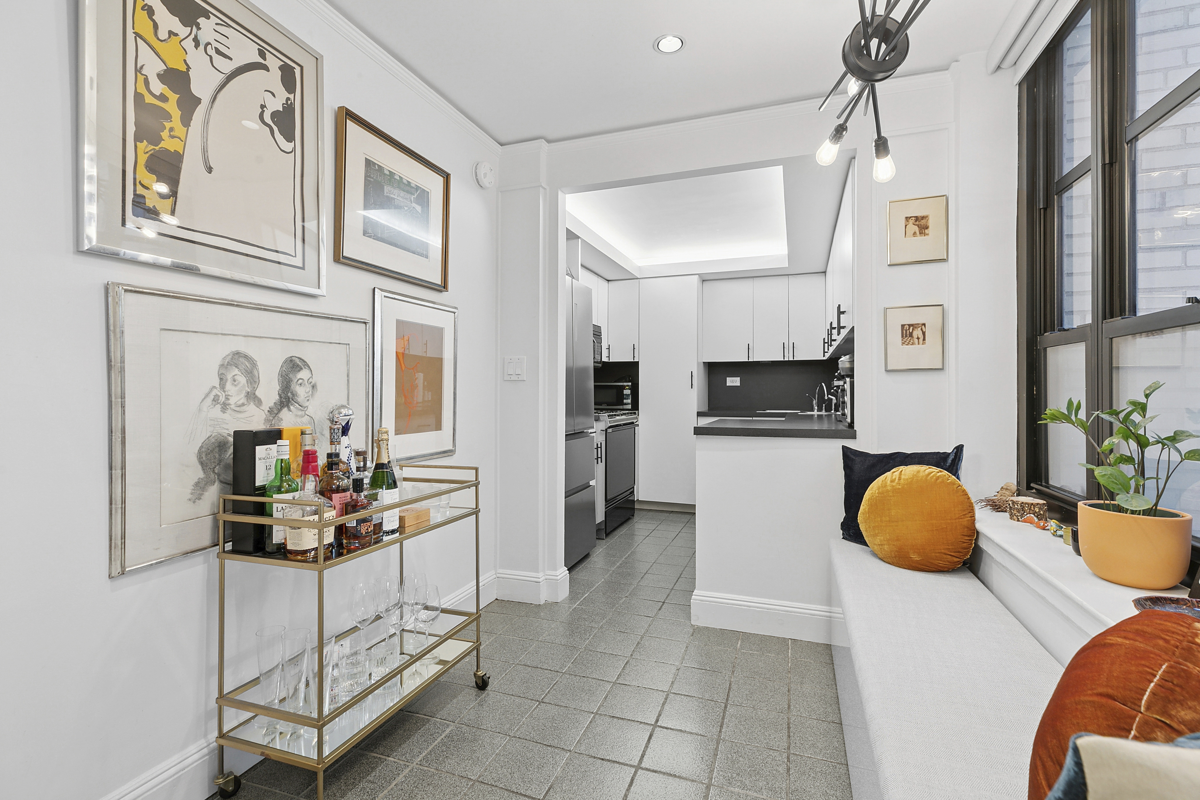 235 East 22nd Street, Unit 4T Manhattan, NY 10010 - Photo 4 of 15 a view of entryway wih livingroom and chandelier