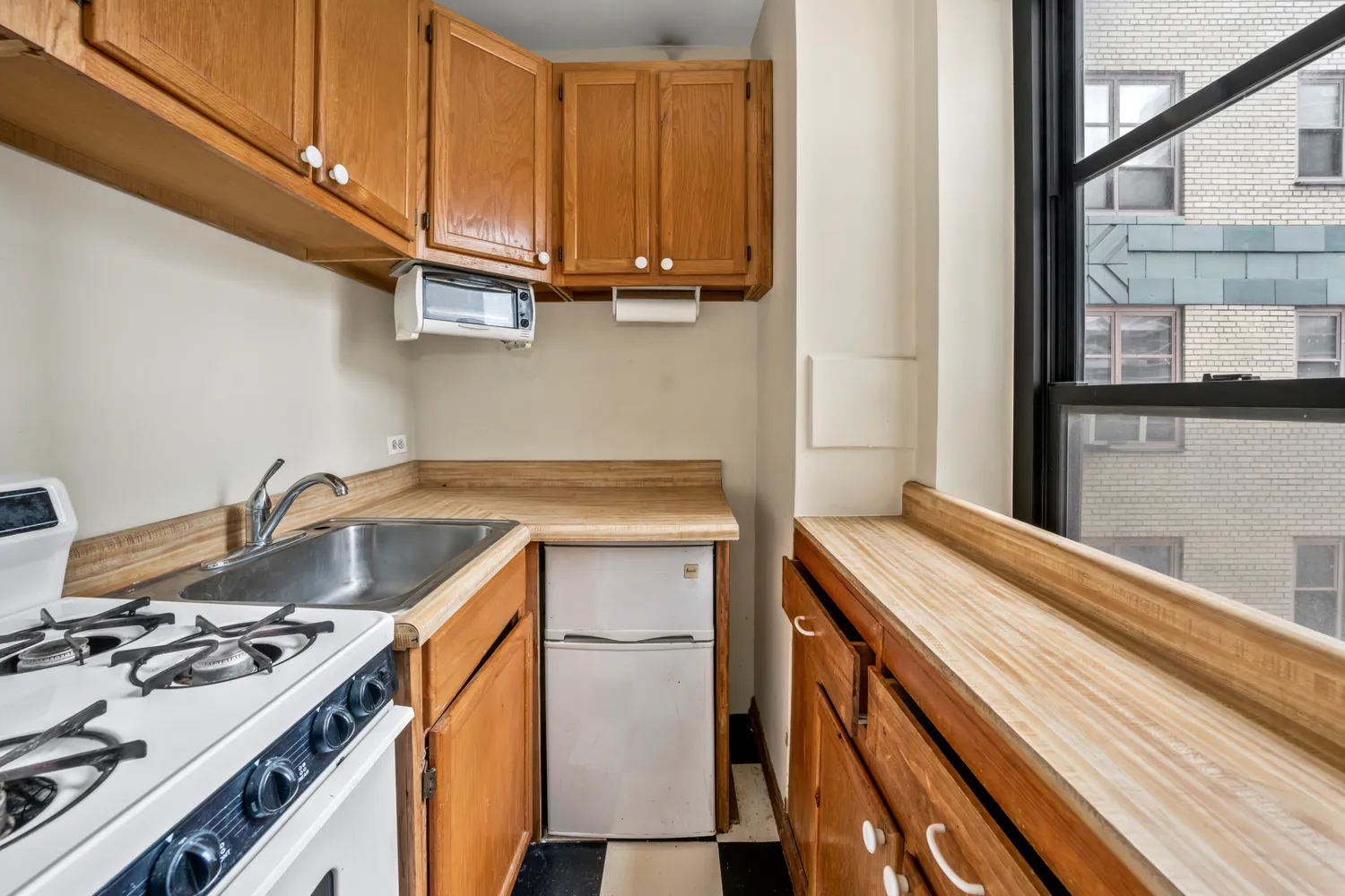 a kitchen with a stove and a sink