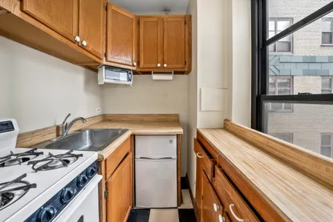 a kitchen with a stove and a sink
