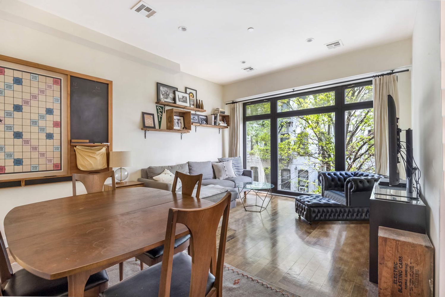 188 15th Street, Unit 201 Brooklyn, NY 11215 - Photo 1 of 13 a dining room with furniture and large windows