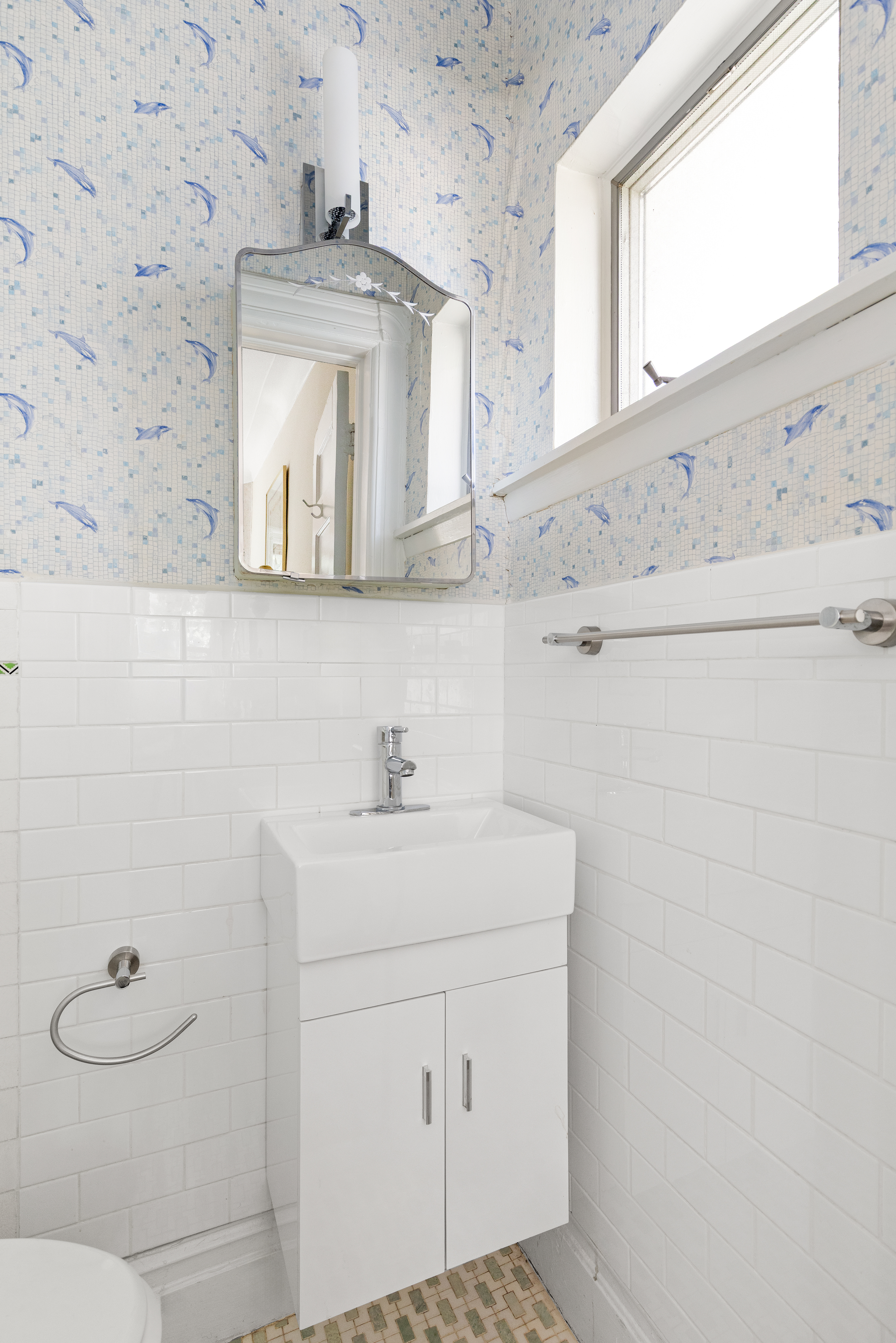 489 Marlborough Road Brooklyn, NY 11226 - Photo 9 of 21 a bathroom with a sink a toilet and mirror