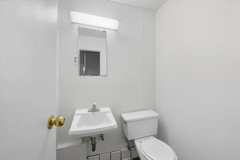 a picture of a bench in front of a wall