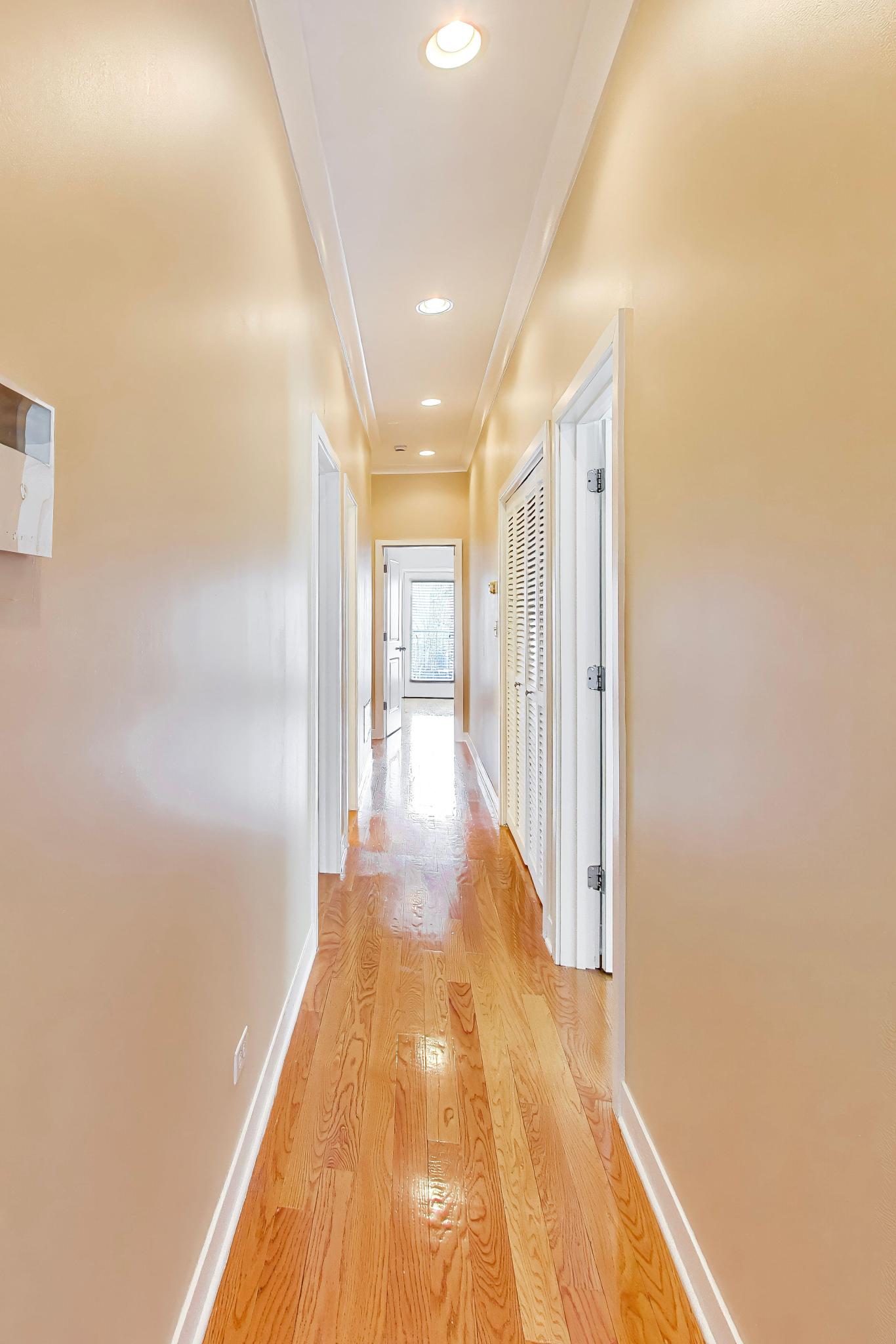 4845 North Springfield Avenue, Unit 2 Chicago, IL 60625 - Photo 21 of 32 a view of a hallway with wooden floor