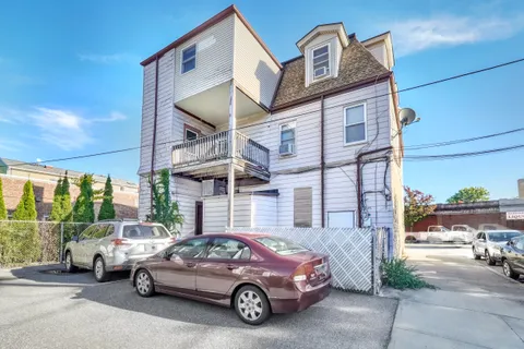 a view of a car parked in front of a building