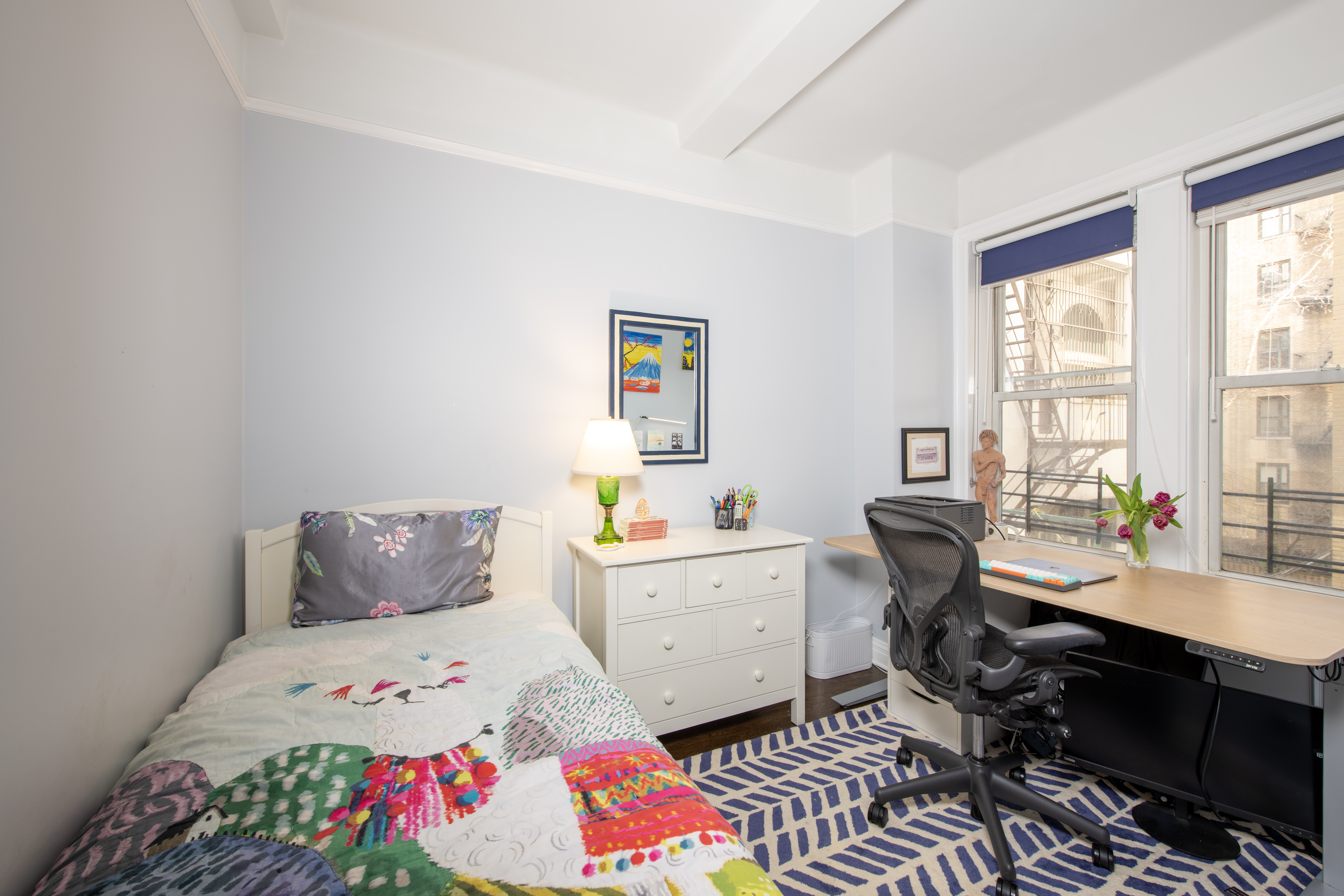 250 West 94th Street, Unit 3F Manhattan, NY 10025 - Photo 6 of 9 a workspace with furniture and window