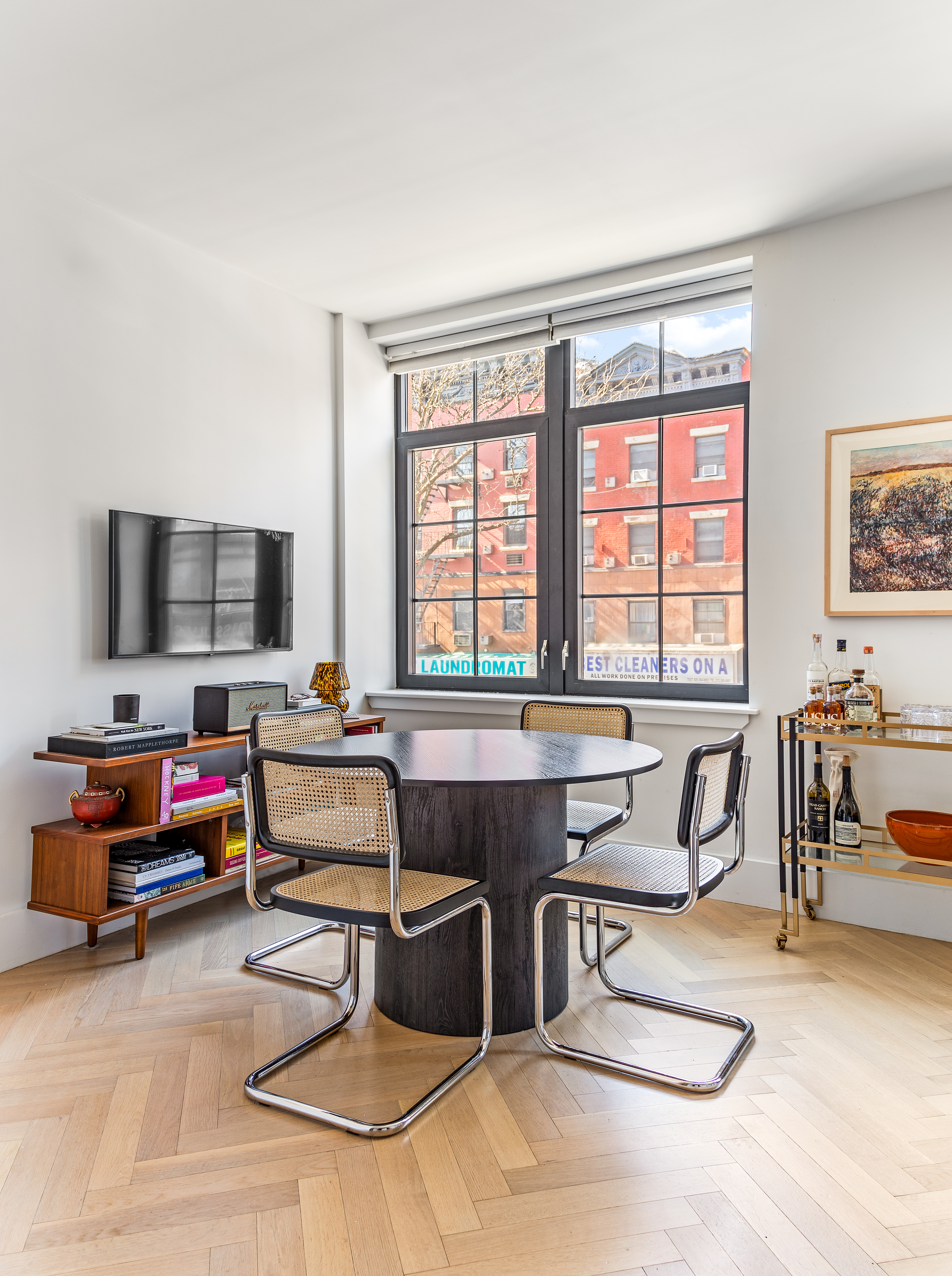 100 Avenue A, Unit 2B Manhattan, NY 10009 - Photo 3 of 11 a living room with furniture and flat screen tv
