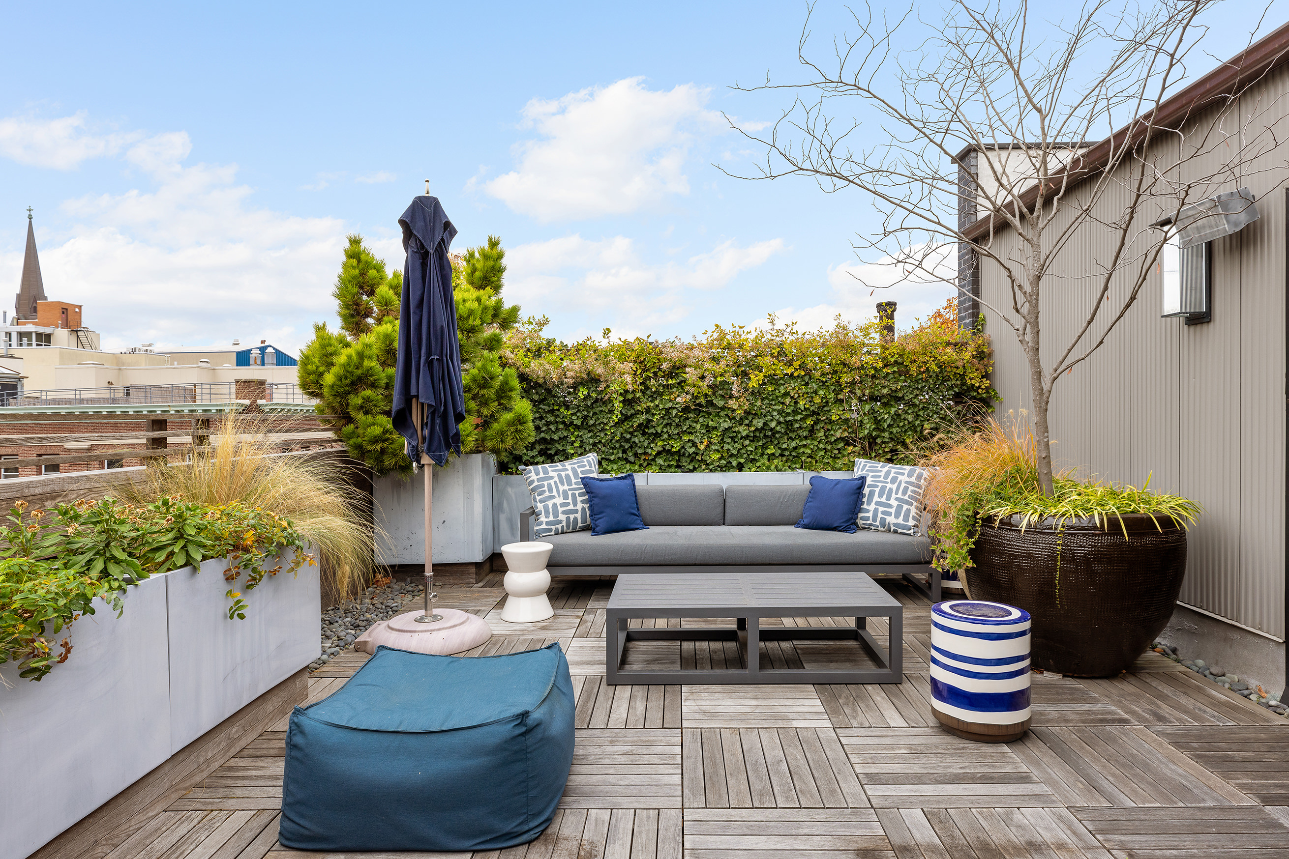 43 Dean Street Brooklyn, NY 11201 - Photo 13 of 17 a patio with patio a couch and potted plants