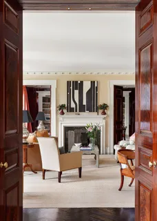 a building outdoor space with patio furniture and kitchen view