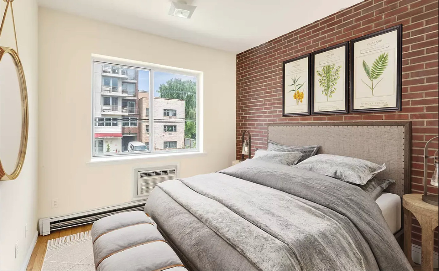68 Maspeth Avenue, Unit 3A Brooklyn, NY 11211 - Photo 3 of 9 a bedroom with a bed and a window