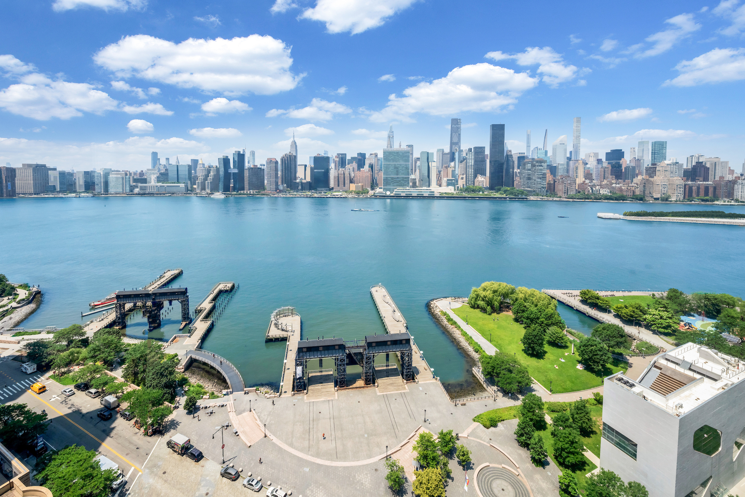 4-74 48th Avenue, Unit 27A Queens, NY 11109 - Photo 5 of 17 an aerial view of a house with a lake view