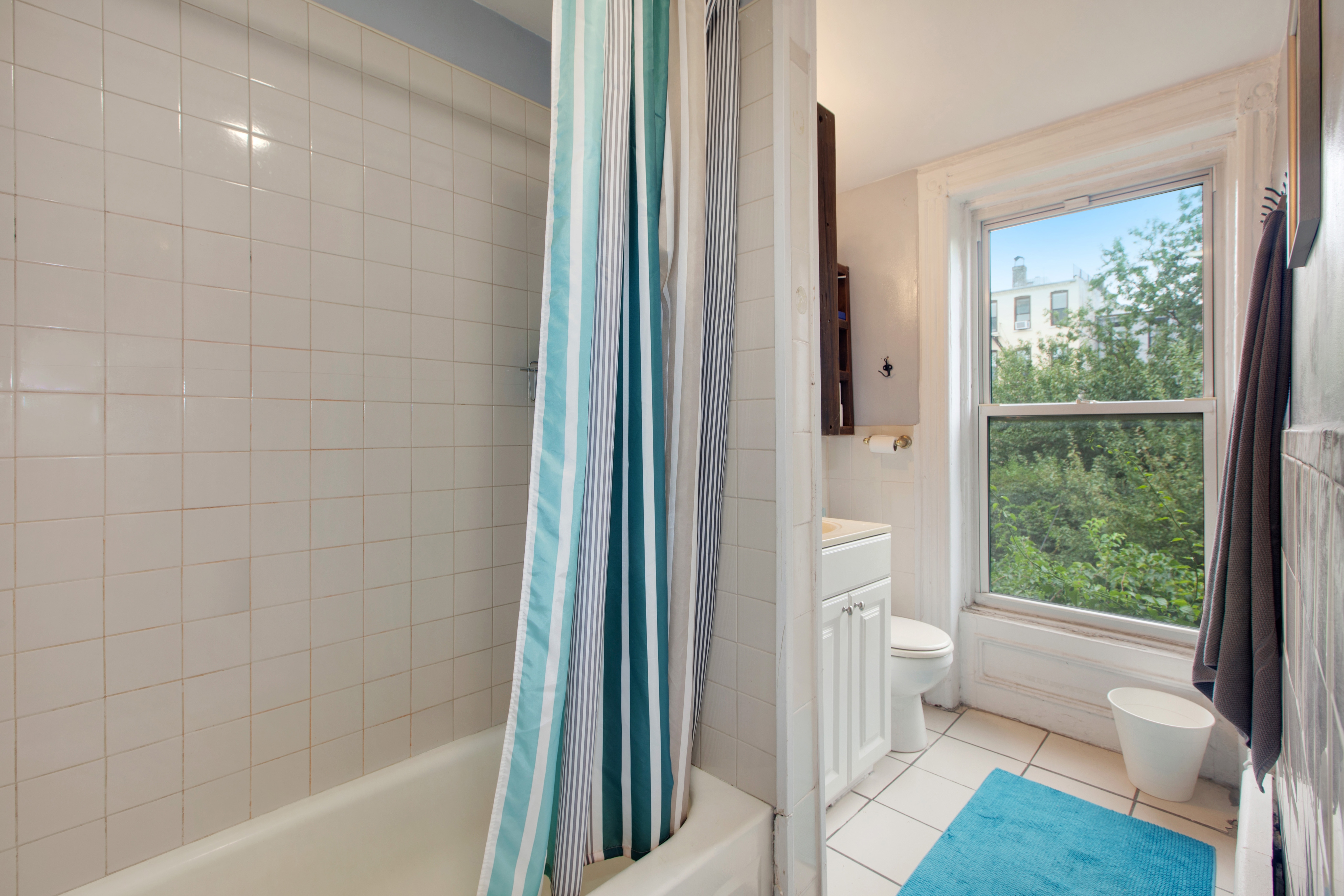 250 Saint Marks Avenue, Unit 3 Brooklyn, NY 11238 - Photo 6 of 8 a bathroom with a toilet a bath tub and a shower