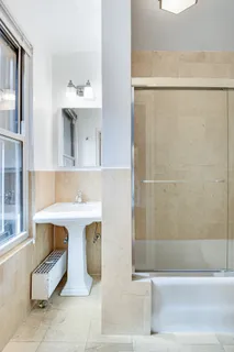 a bathroom with a sink and mirror
