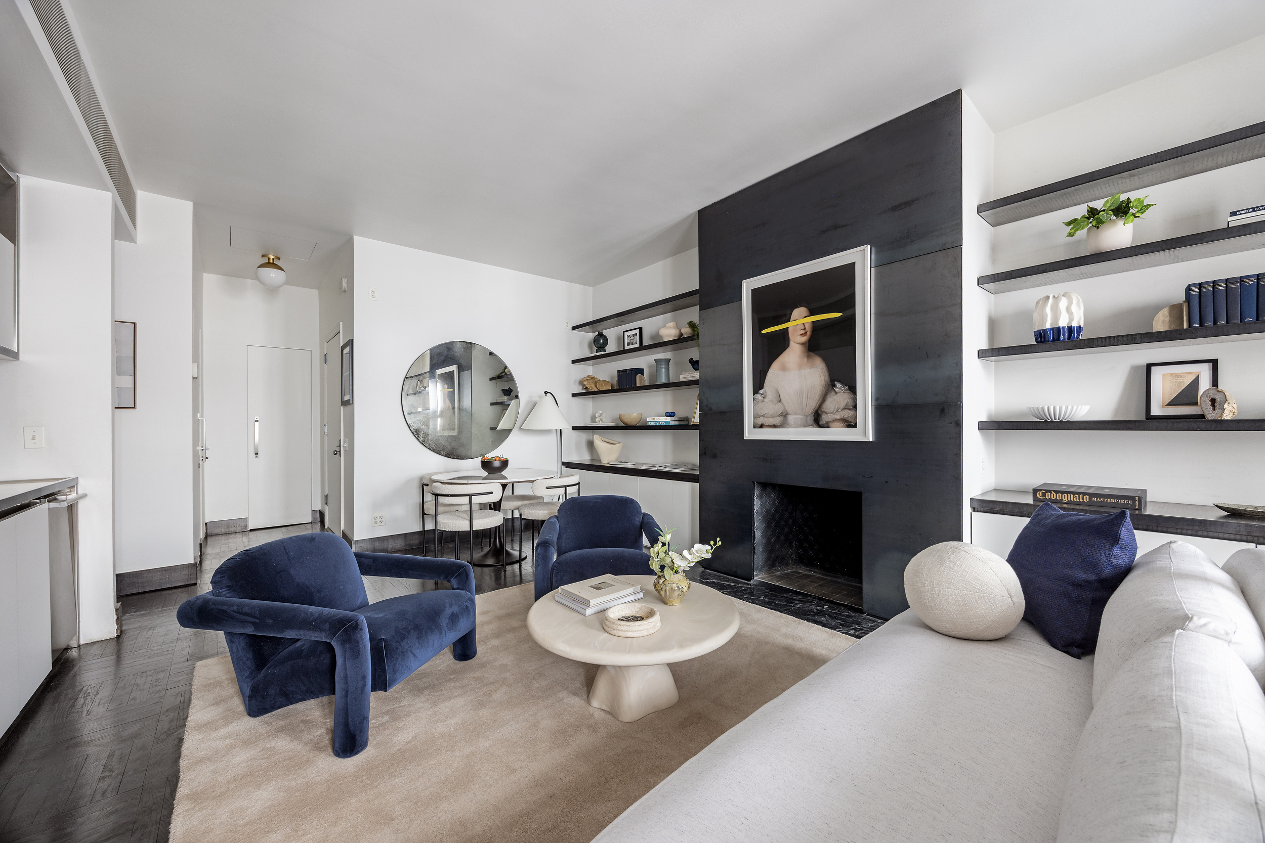 15 East 70th Street, Unit PHB Manhattan, NY 10021 - Photo 24 of 35 a living room with furniture a fireplace and a window