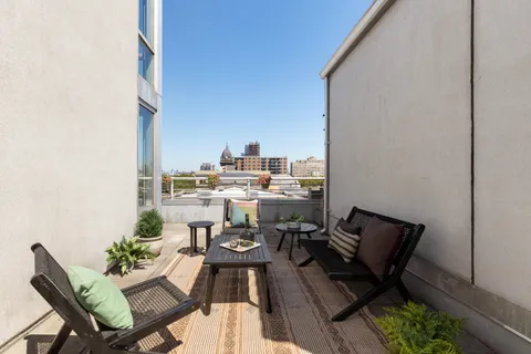 a view of a terrace with furniture