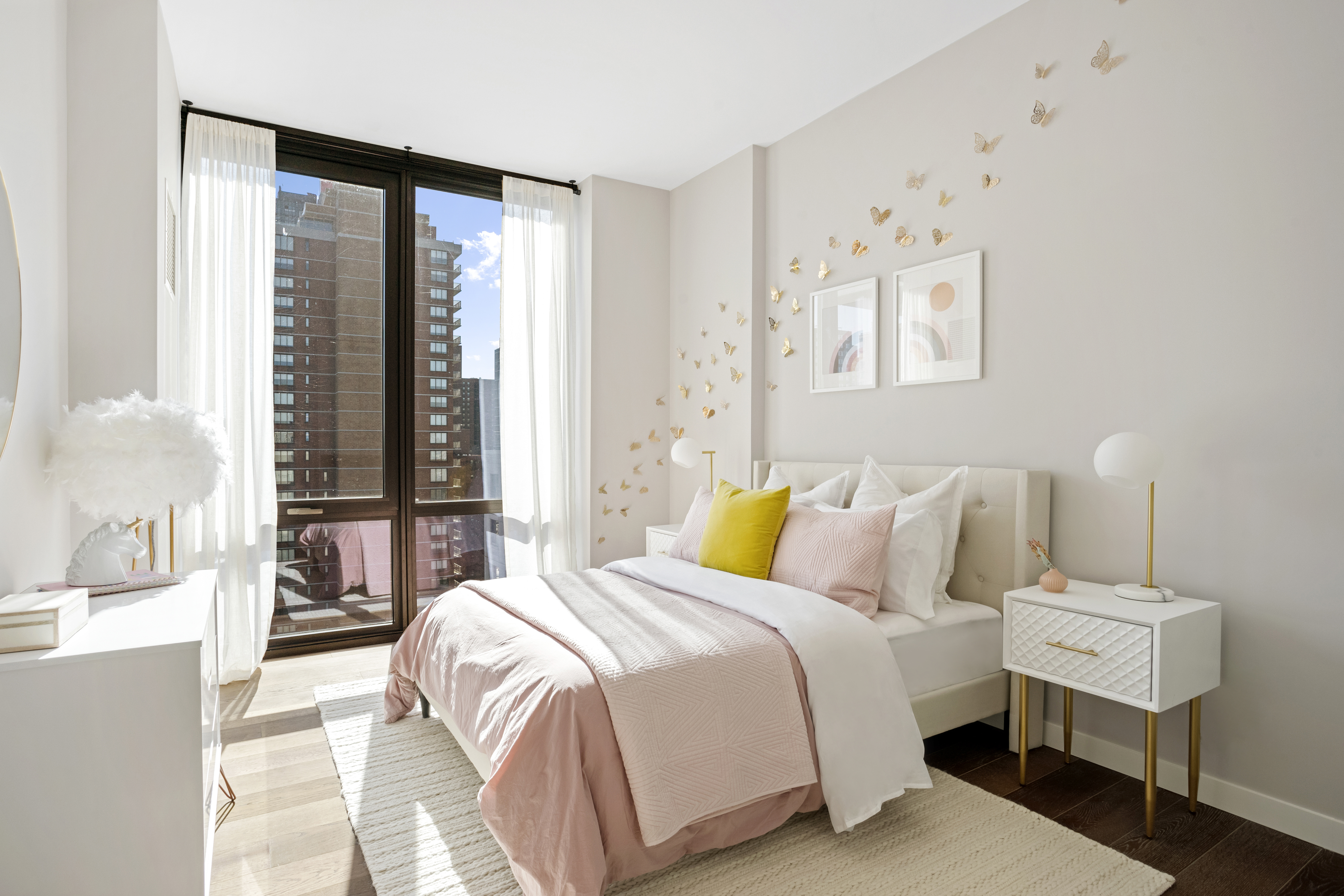 302 East 96th Street, Unit PH6 Manhattan, NY 10128 - Photo 7 of 13 a bedroom with a bed and a night stand