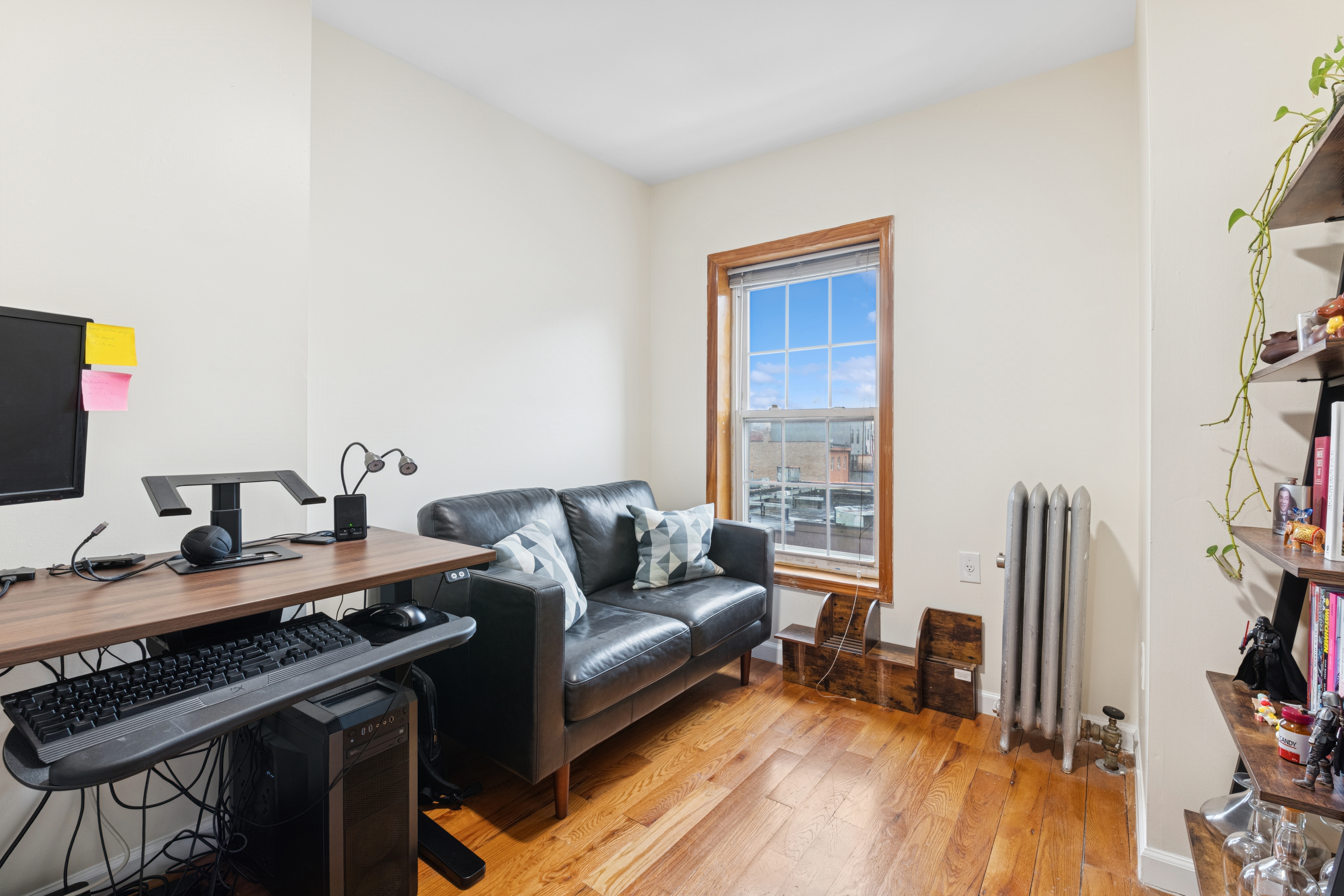 514 Classon Avenue, Unit 3 Brooklyn, NY 11238 - Photo 5 of 7 a living room with furniture and a flat screen tv
