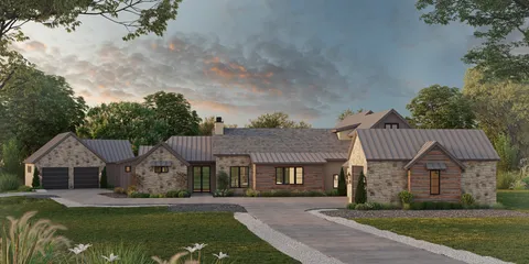 a front view of a house with a garden and yard