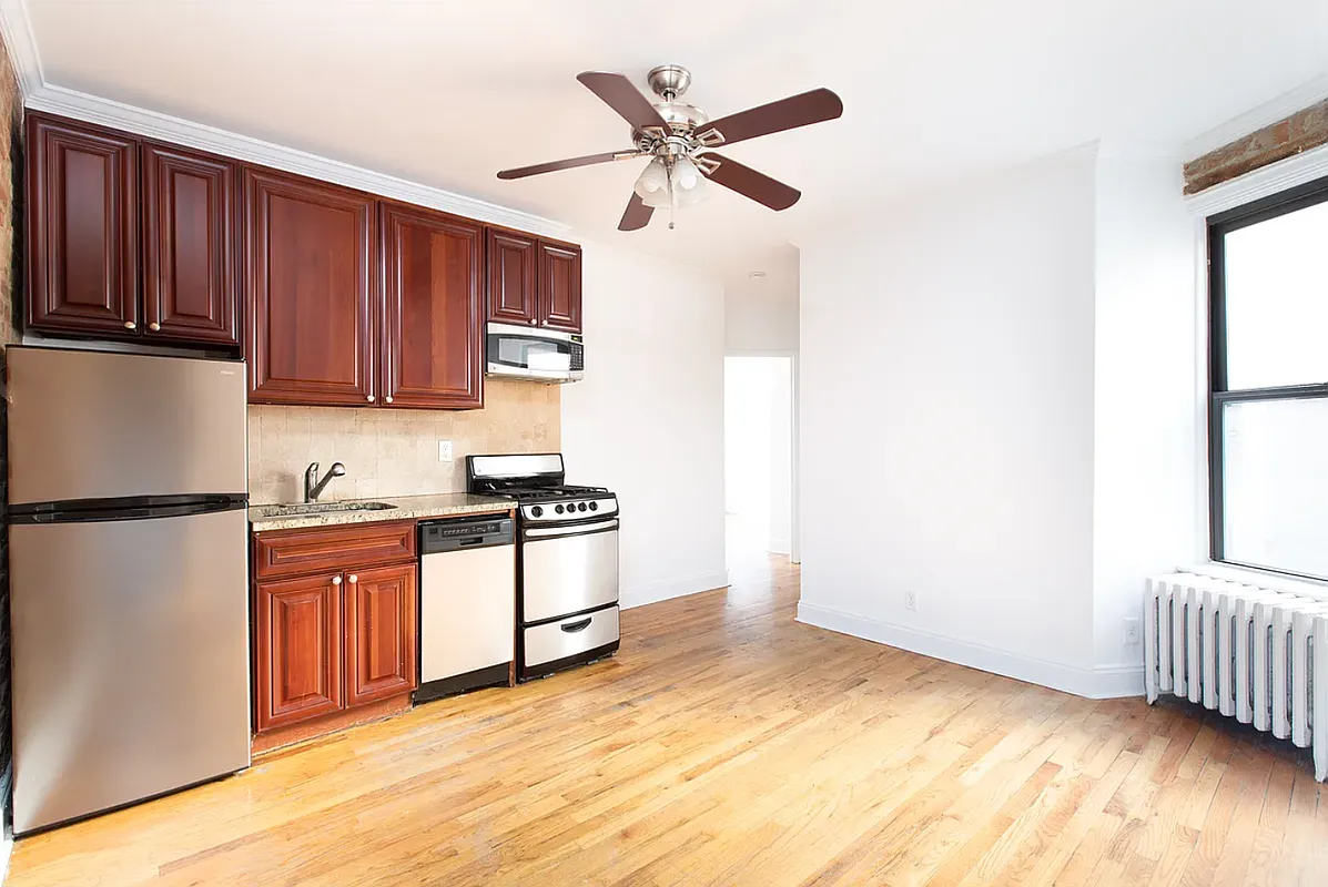 649 East 9th Street, Unit D3 Manhattan, NY 10009 - Photo 1 of 5 a kitchen with stainless steel appliances granite countertop a refrigerator sink and stove