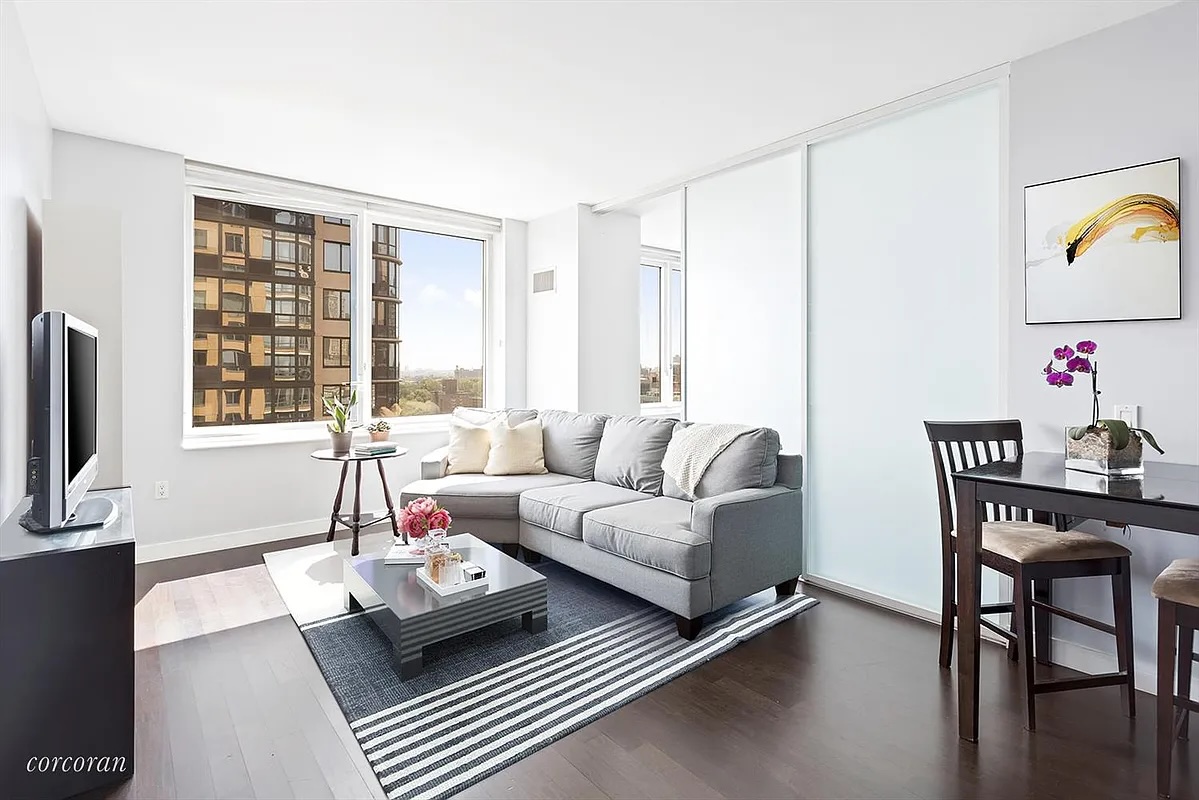 306 Gold Street, Unit 22B Brooklyn, NY 11201 - Photo 2 of 11 a living room with furniture and a large window