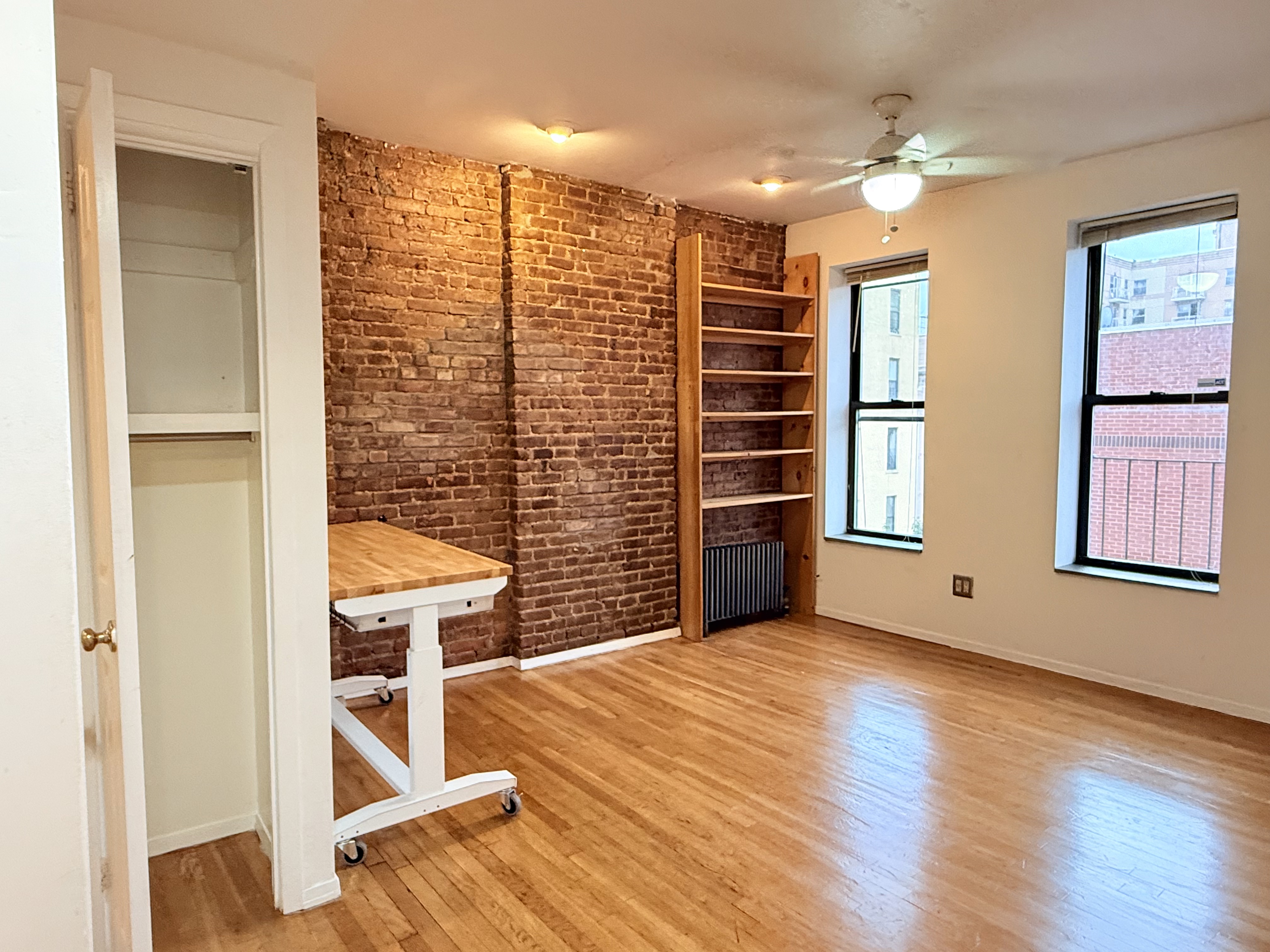1672 Park Avenue, Unit 4A Manhattan, NY 10035 - Photo 7 of 11 a view of livingroom with furniture and chandelier