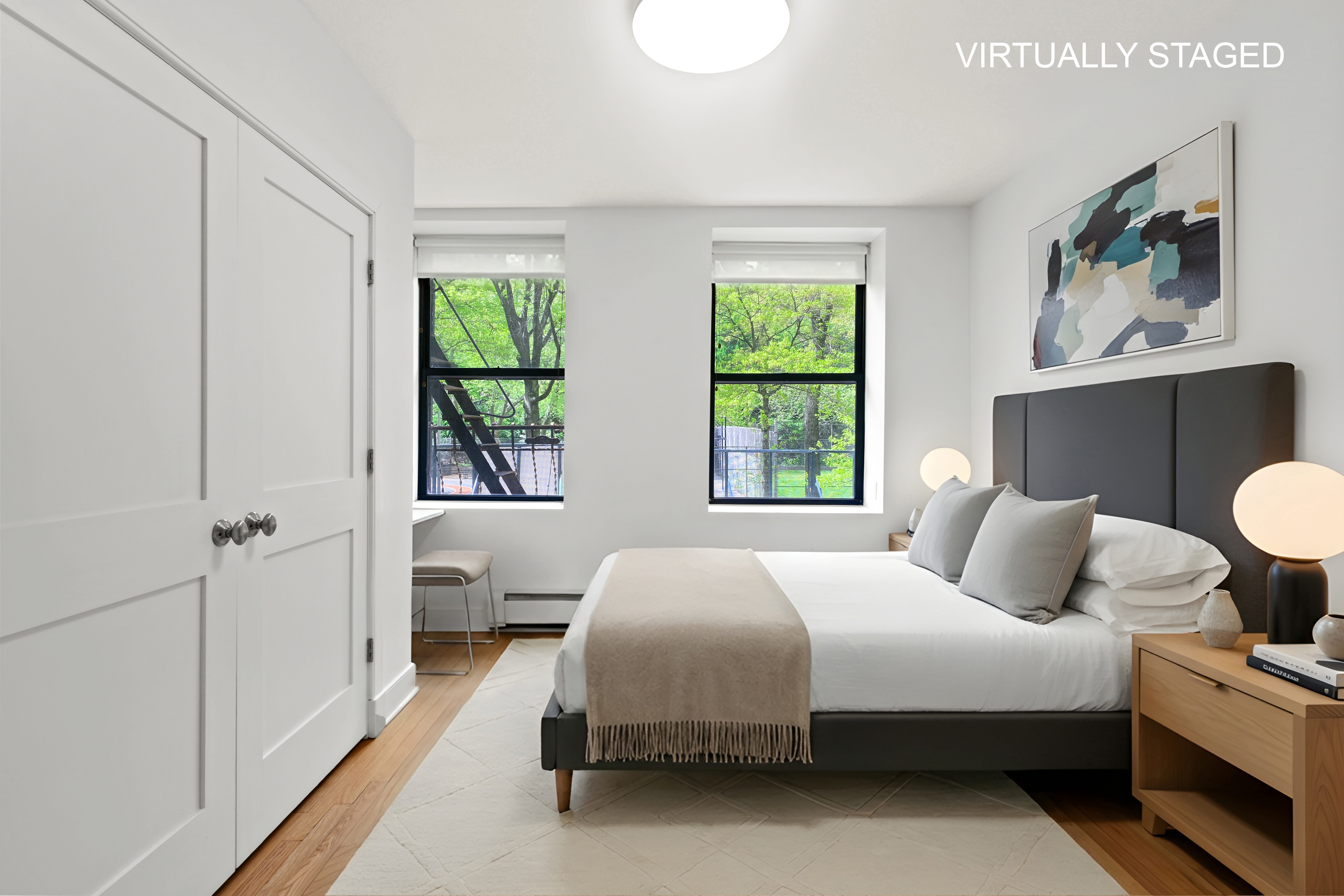 305 West 150th Street, Unit 206 Manhattan, NY 10039 - Photo 1 of 18 a bedroom with a bed and window