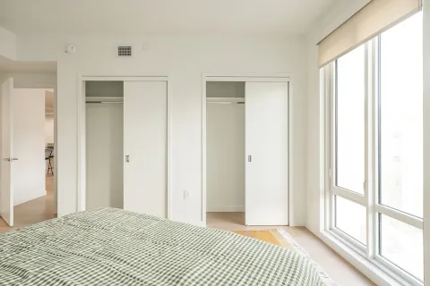 a view of a room that has a bed in it
