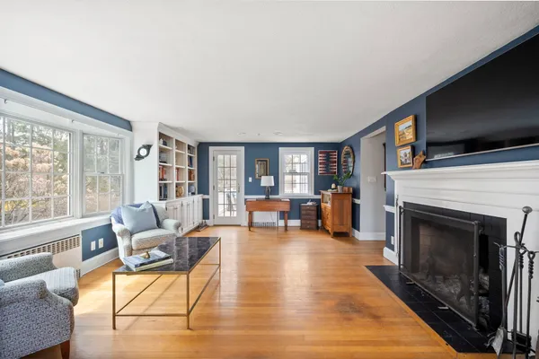 a living room with furniture and a fireplace