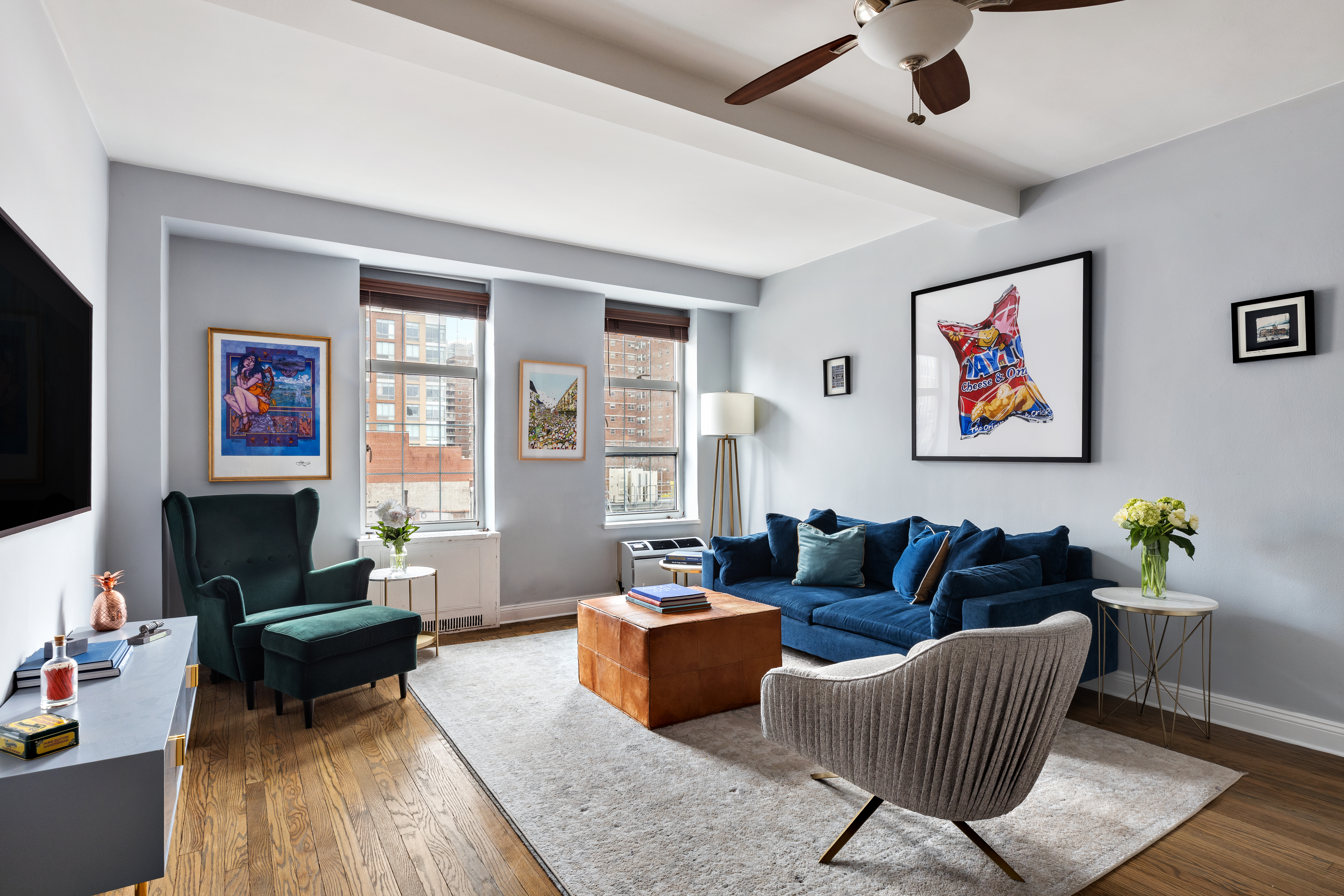 a living room with furniture and a flat screen tv