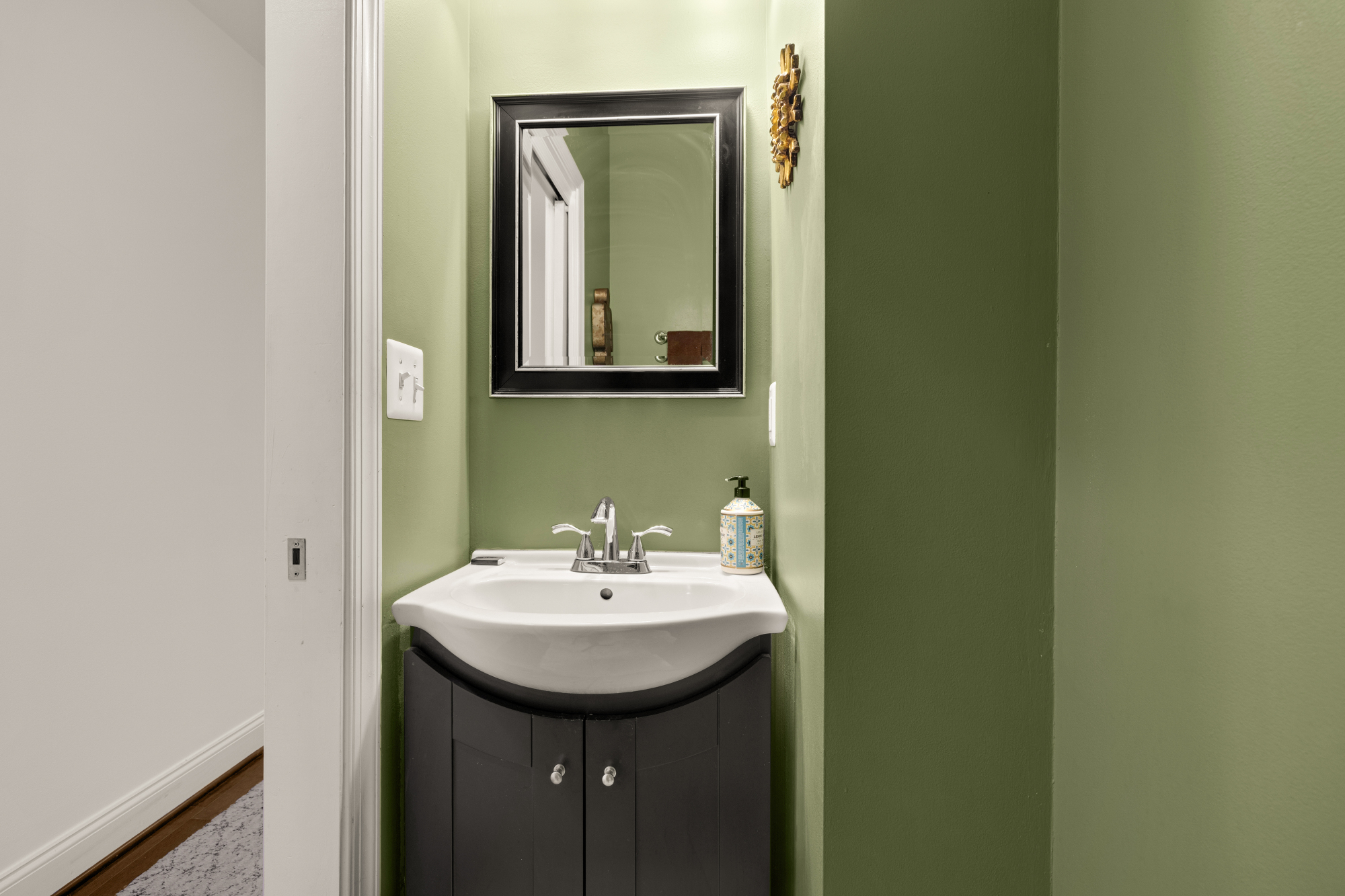 233 S Street Northeast, Unit 4 Washington, DC 20002 - Photo 18 of 37 a bathroom with a sink and a mirror