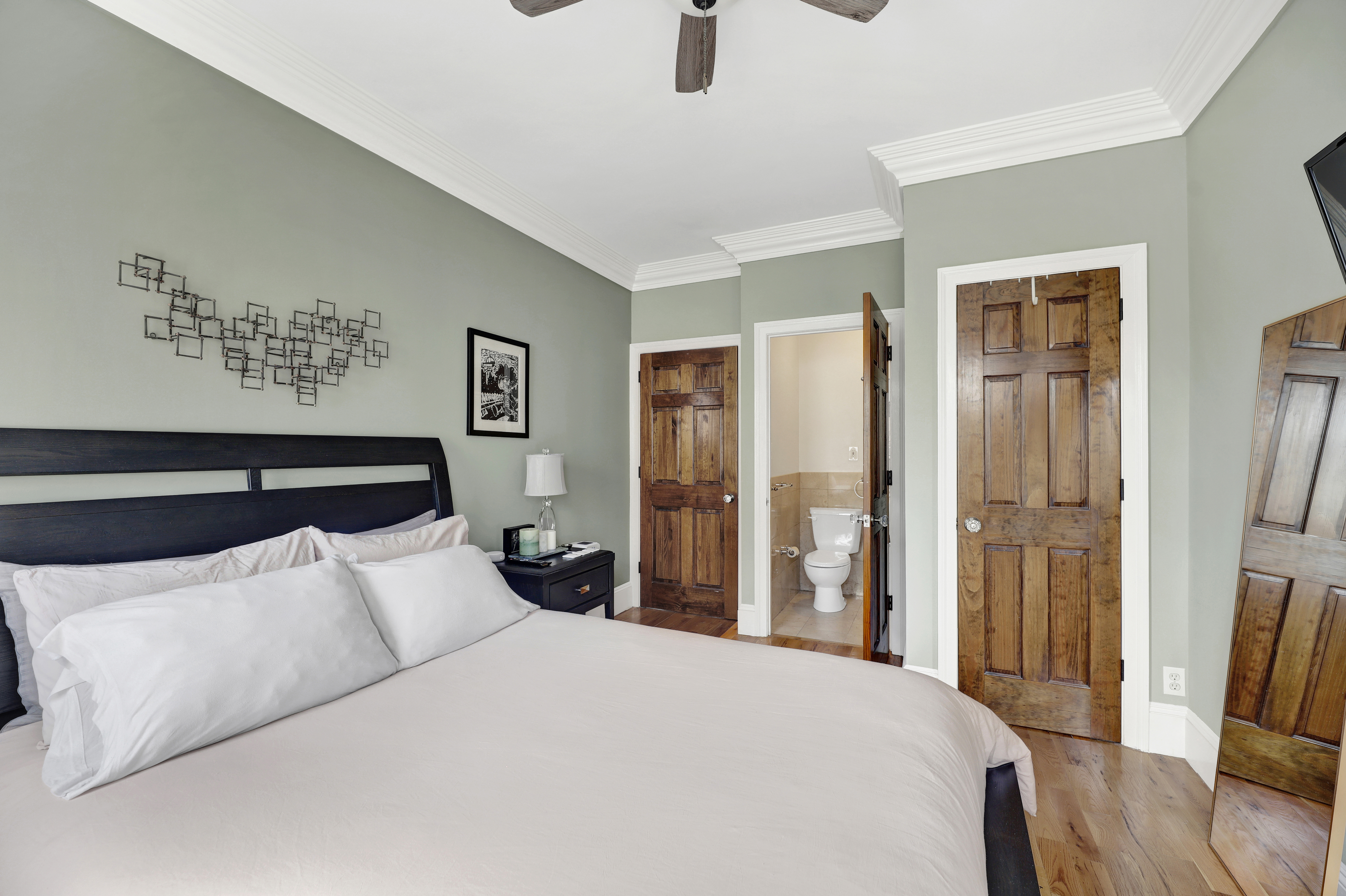 36 Russell Street, Unit 22 Brooklyn, NY 11222 - Photo 20 of 27 a bedroom with a large bed and wooden floor