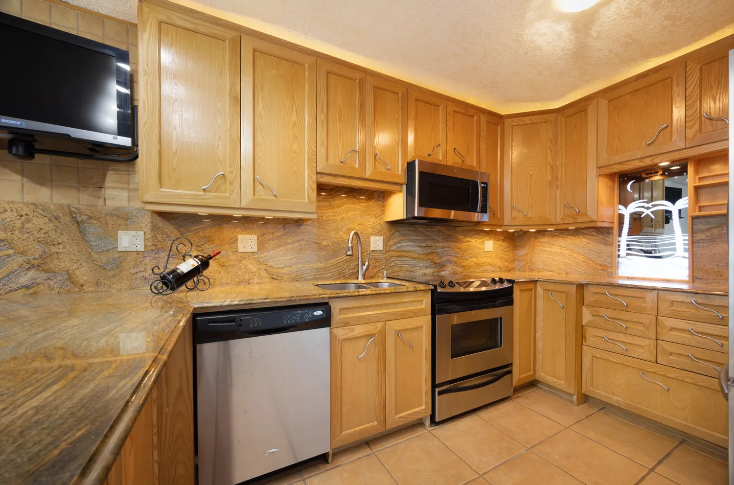 a view of a hallway with a chandelier fan
