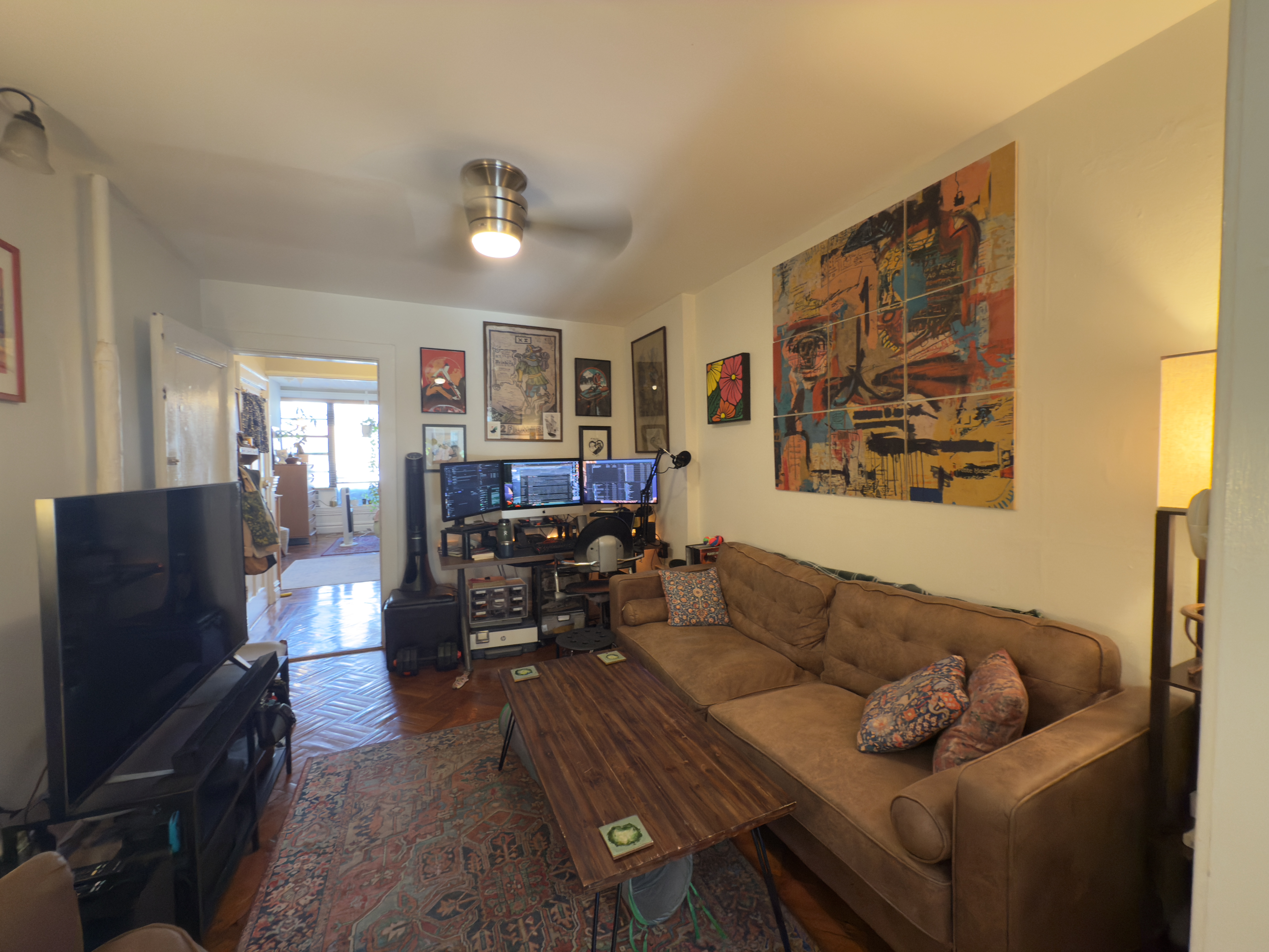 141 7th Avenue, Unit 1 Brooklyn, NY 11215 - Photo 8 of 16 a living room with furniture and a flat screen tv