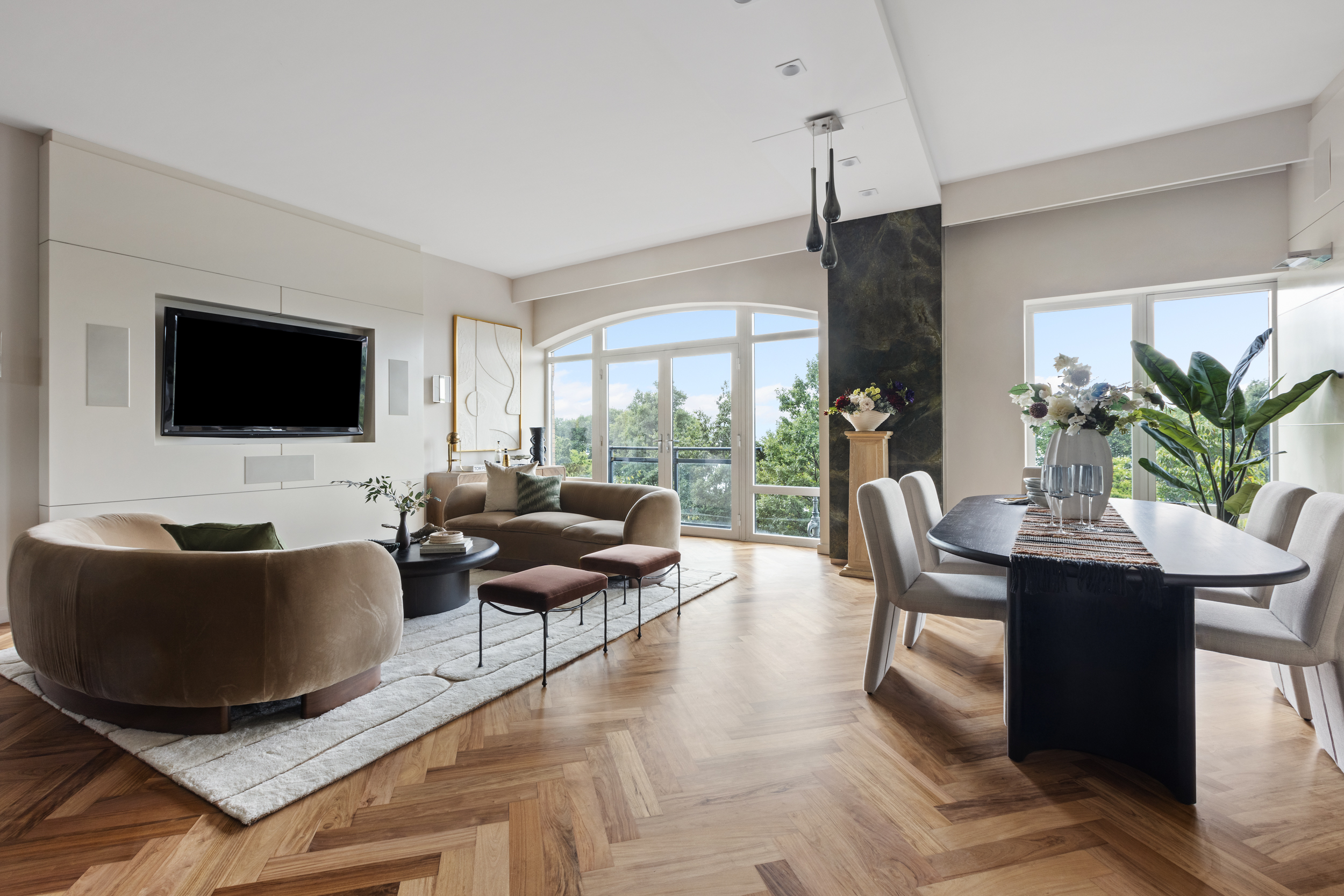 400 West 12th Street, Unit 4E Manhattan, NY 10014 - Photo 2 of 24 a living room with furniture and a flat screen tv