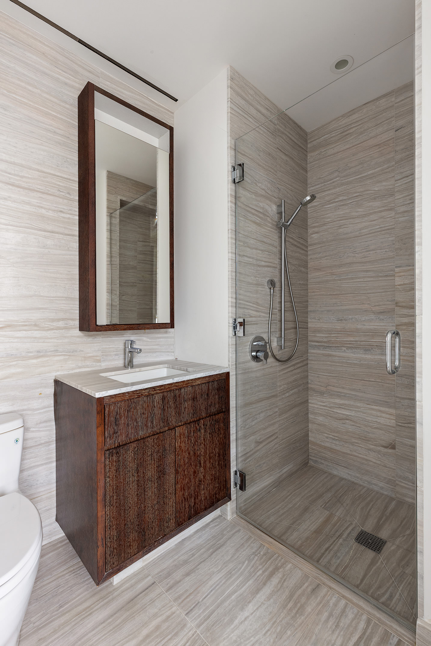 505 West 19th Street, Unit 7B Manhattan, NY 10011 - Photo 10 of 16 a bathroom with a toilet sink and shower