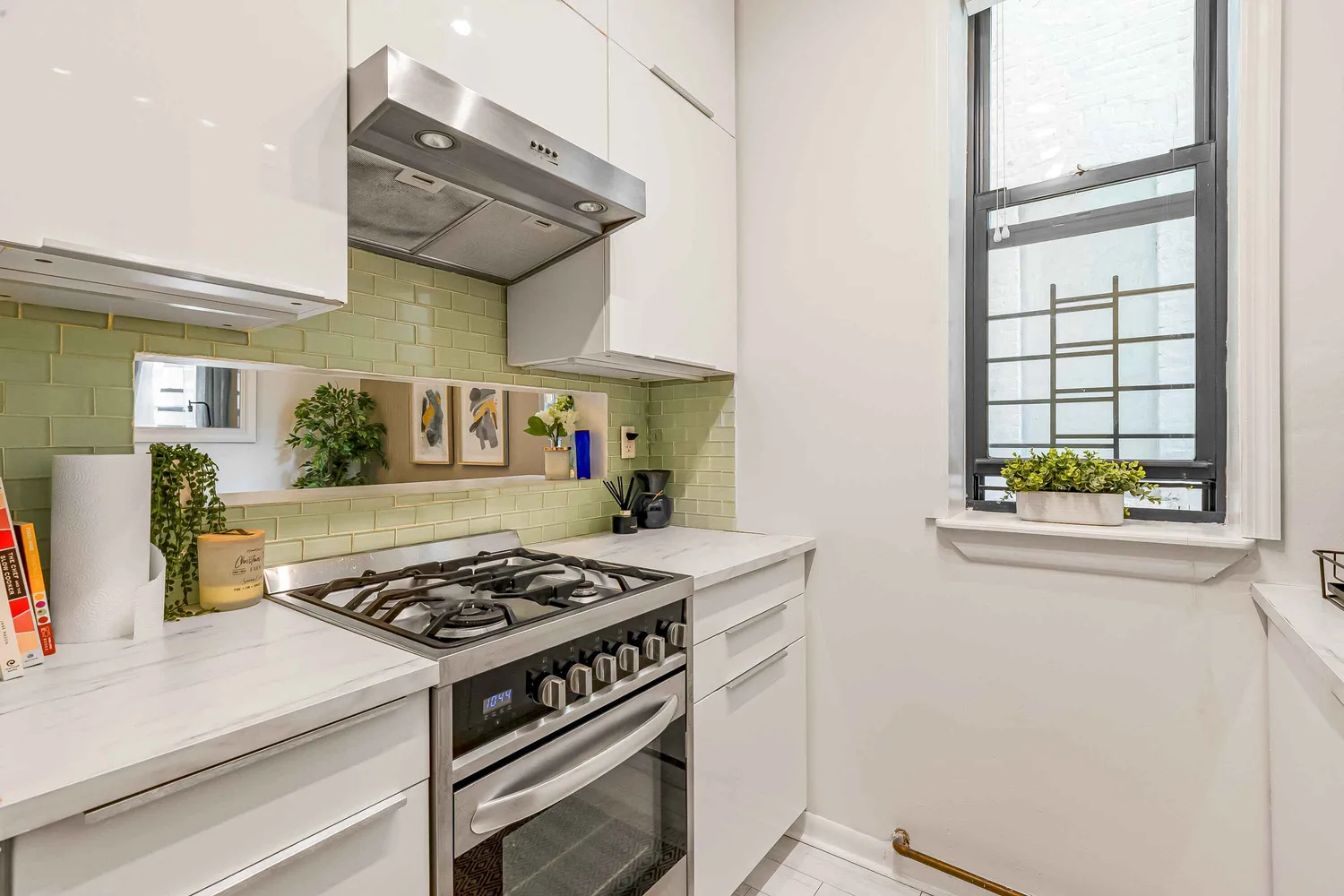 a kitchen with stainless steel appliances granite countertop a stove and a refrigerator