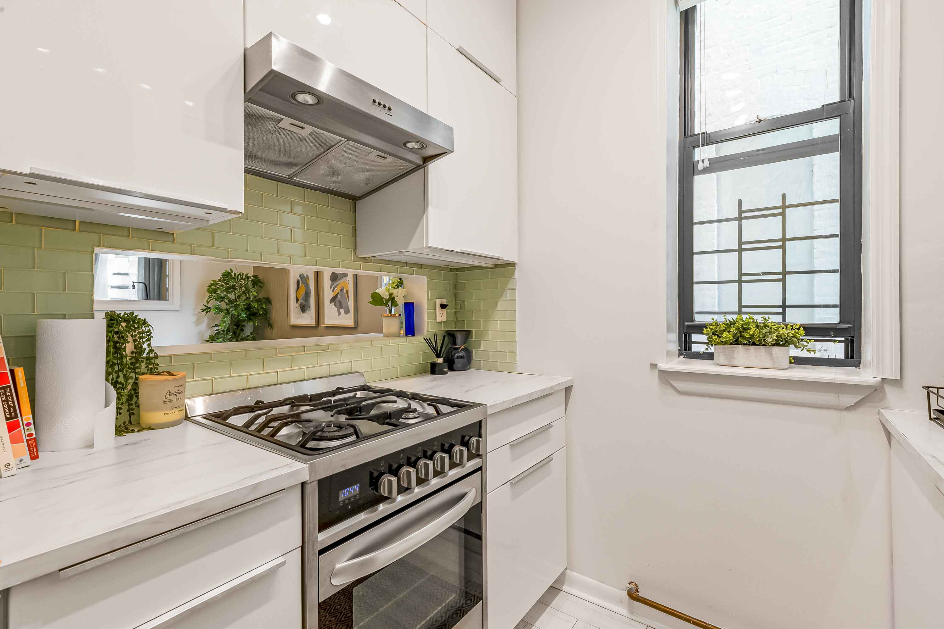 108 West 114th Street, Unit 4B Manhattan, NY 10026 - Photo 7 of 11 a kitchen with stainless steel appliances granite countertop a stove and a refrigerator