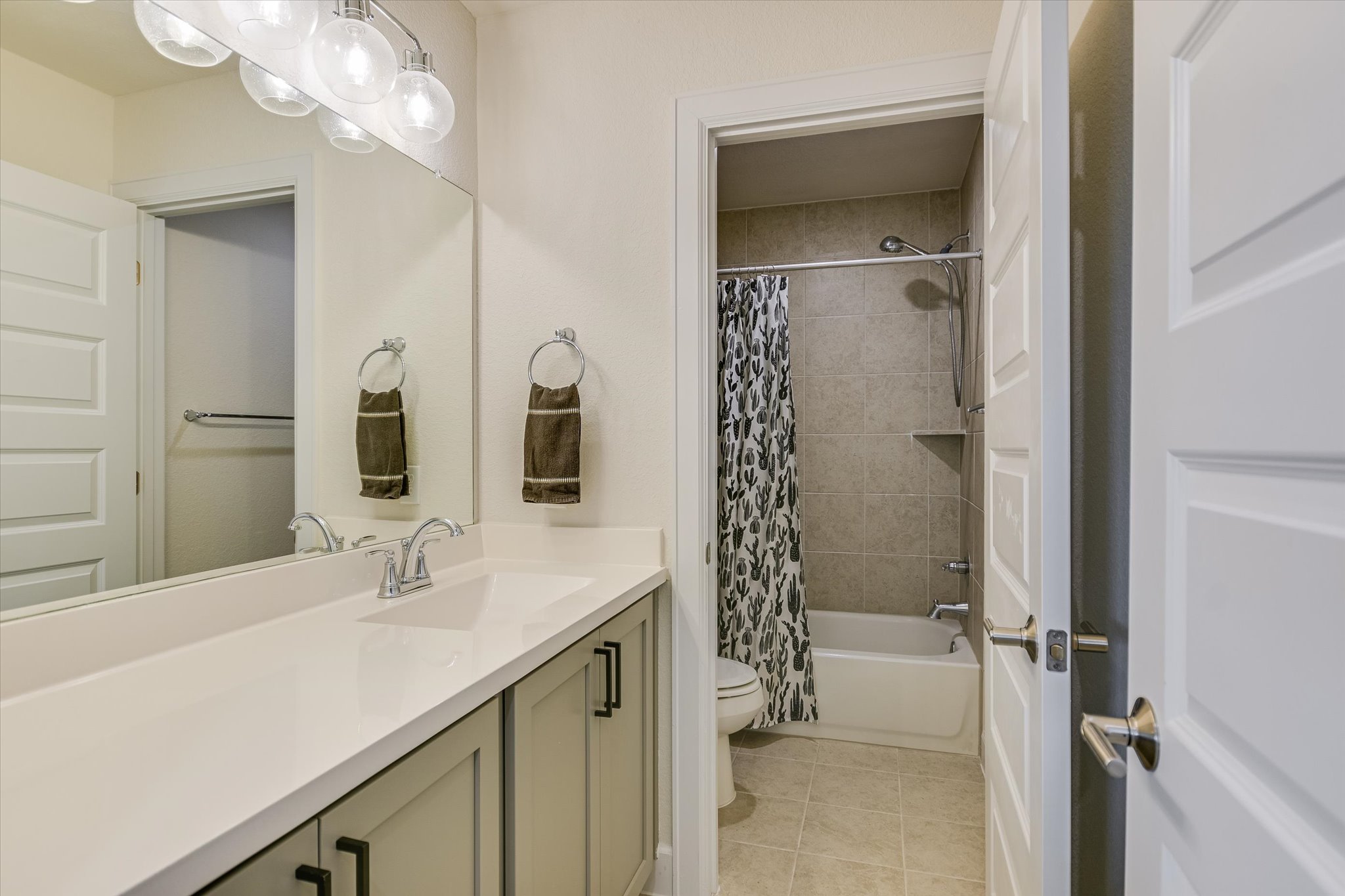 8607 McKamy Drive Austin, TX 78744 - Photo 16 of 28 a bathroom with a sink and a mirror