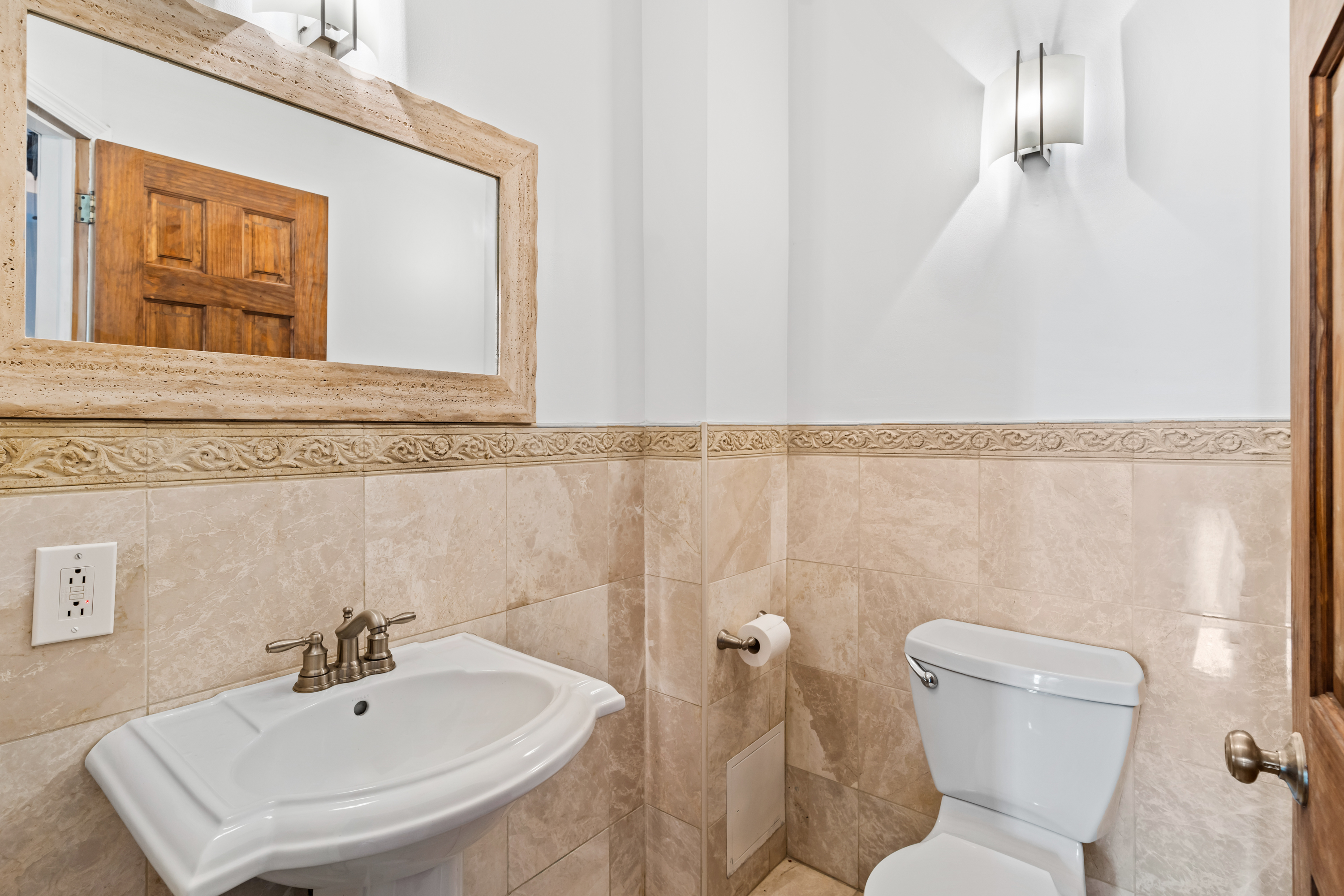 60-13 Menahan Street, Unit 1 Queens, NY 11385 - Photo 9 of 19 a bathroom with a sink a toilet and mirror