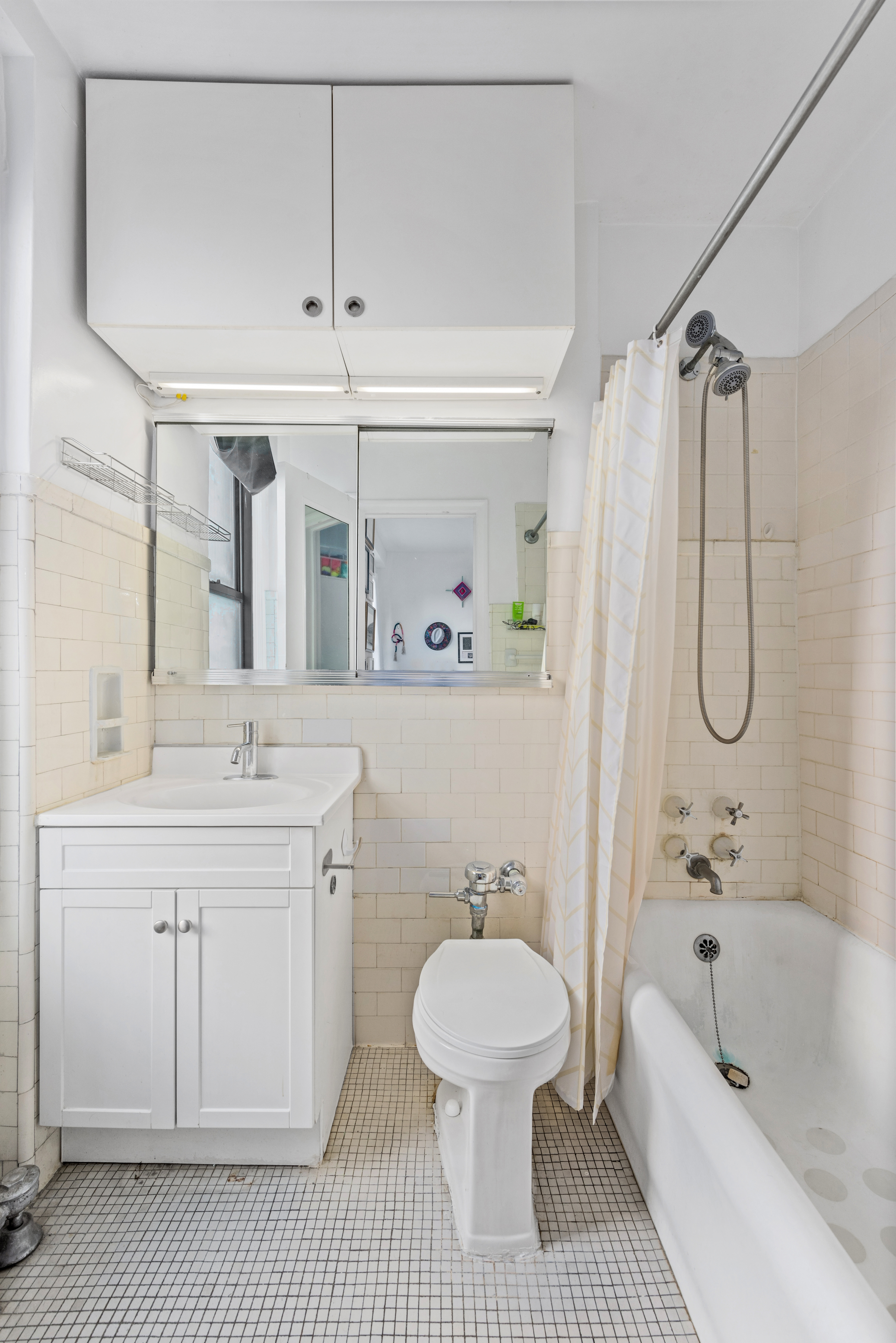 225 Central Park West, Unit 619 Manhattan, NY 10024 - Photo 5 of 6 a bathroom with a sink a toilet and a bathtub
