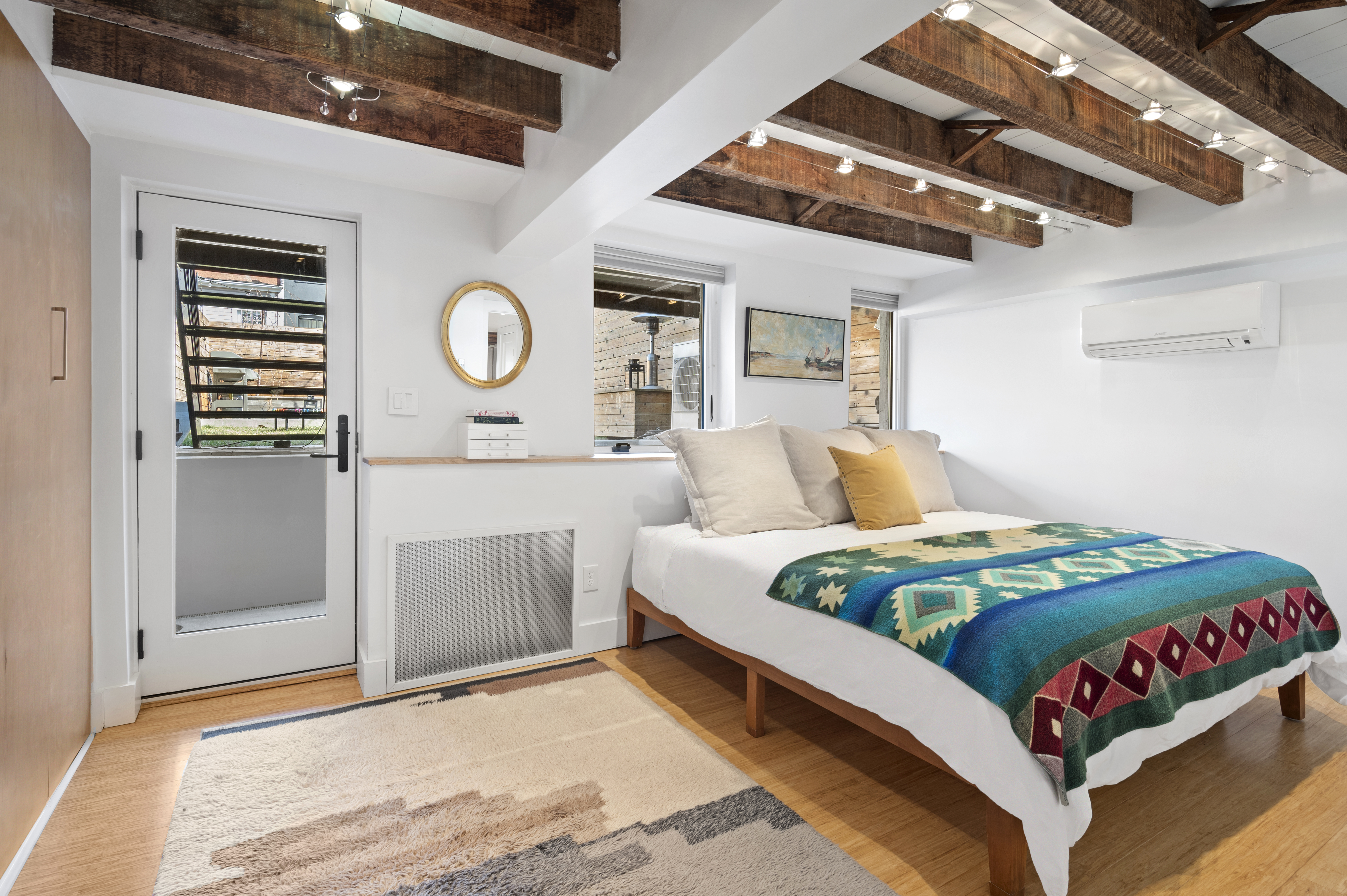 185 East 31st Street Brooklyn, NY 11226 - Photo 8 of 23 a bedroom with a bed and a fan