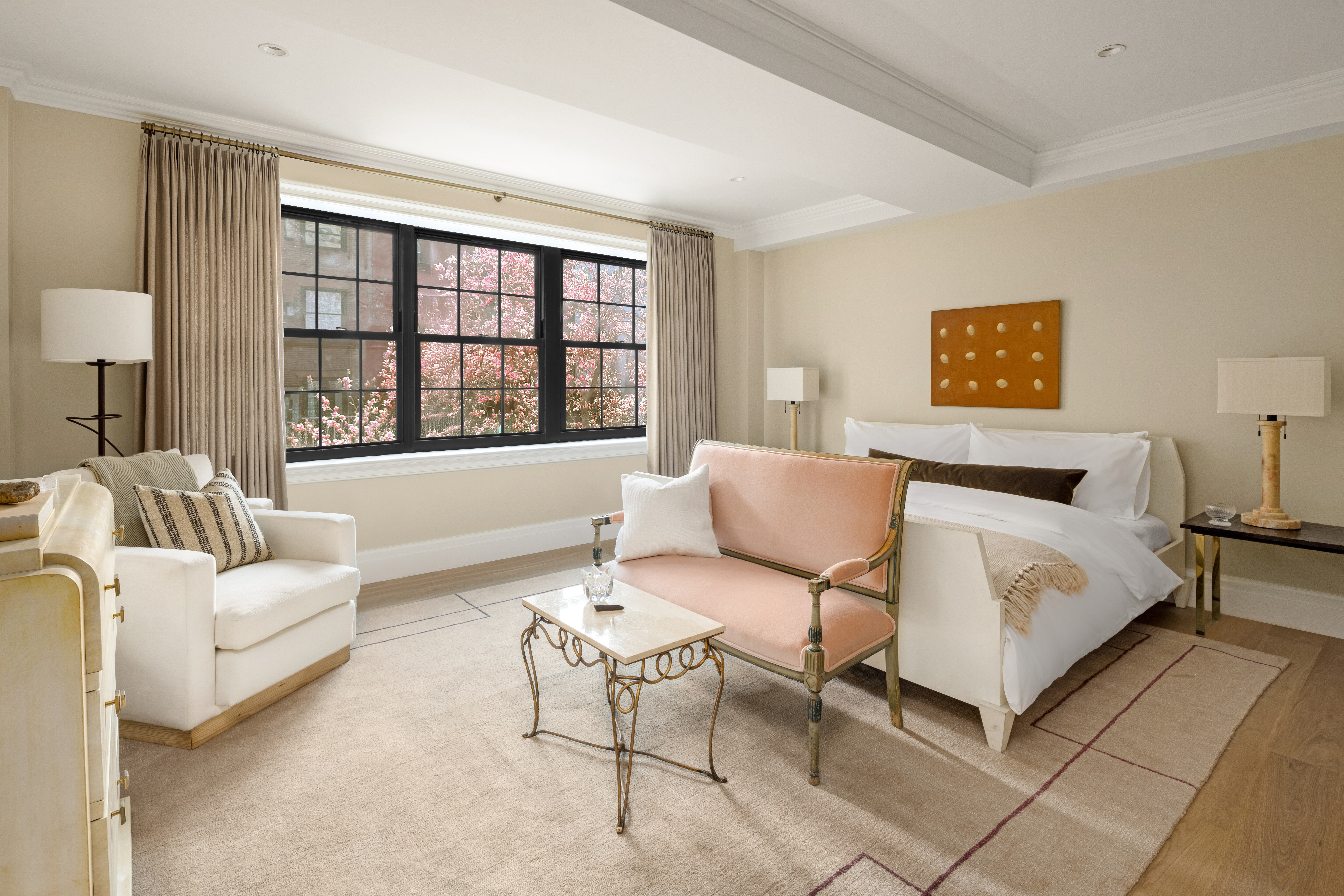 118 West 13th Street, Unit 4 Manhattan, NY 10011 - Photo 13 of 21 a spacious bedroom with a bed a couch and a window