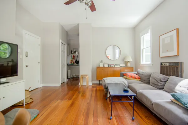 a living room with furniture and a flat screen tv