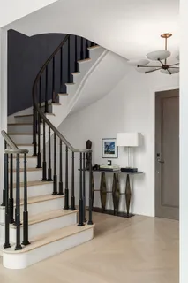 a view of a hallway with stairs