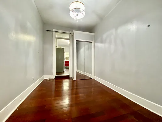 254 Wyckoff Street, Unit 2L Brooklyn, NY 11217 - Photo 6 of 8 an empty room with wooden floor and windows