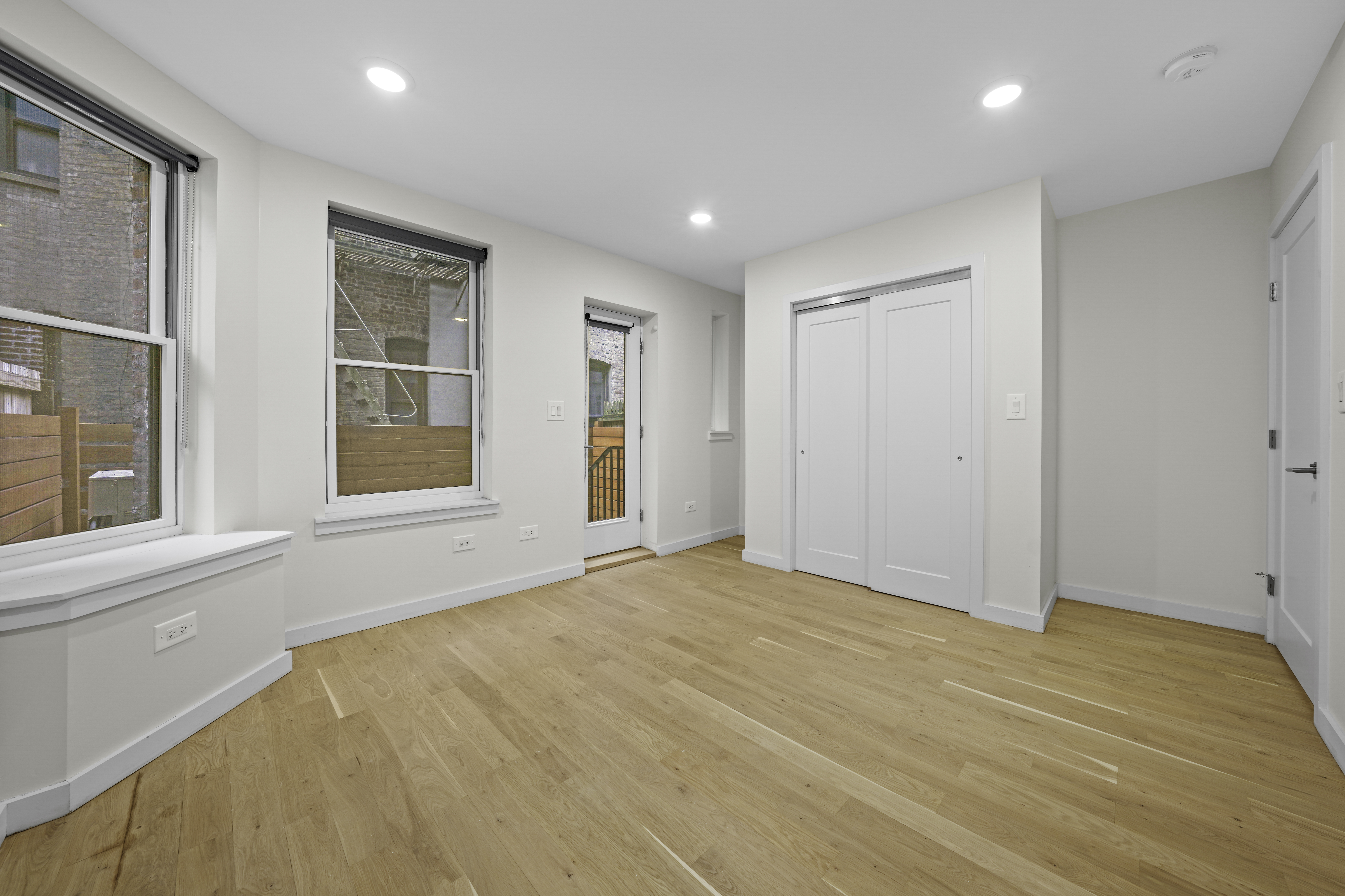 950 St Nicholas Avenue, Unit 1 Manhattan, NY 10032 - Photo 8 of 16 a view of an empty room with a window